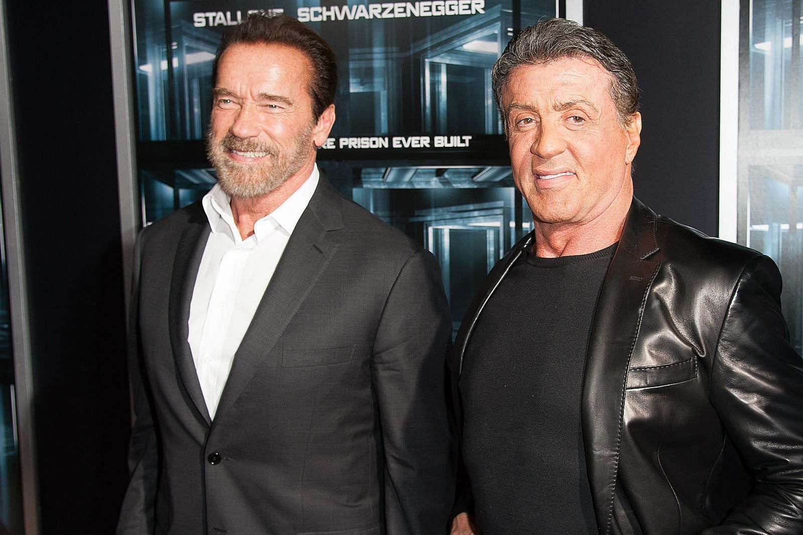 Arnold Schwarzenegger and Sylvester Stallone (via Getty Images)