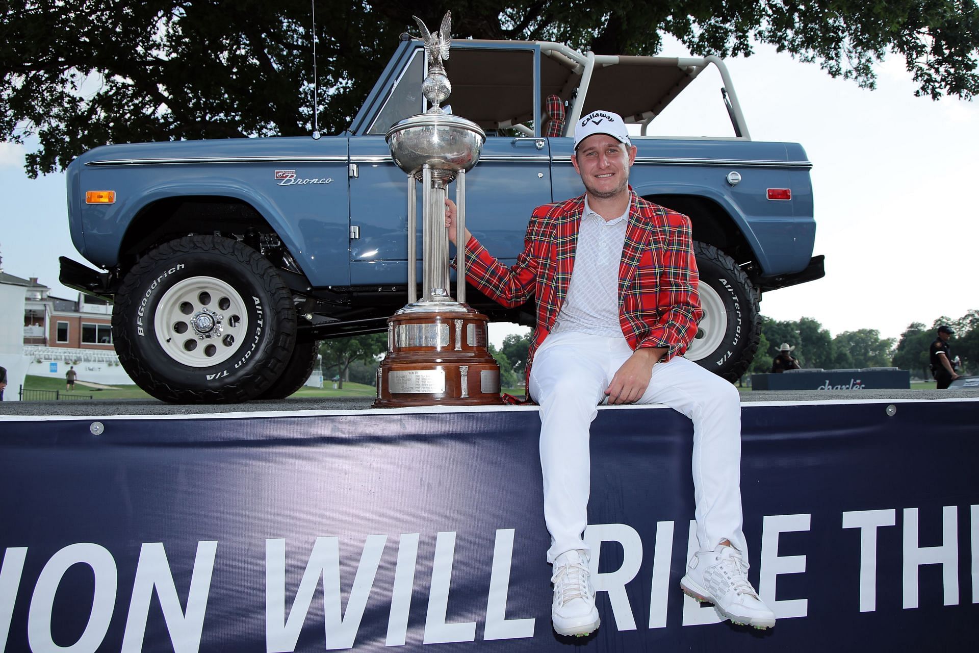 Emiliano Grillo poses with the Charles Schwab Challenge trophy
