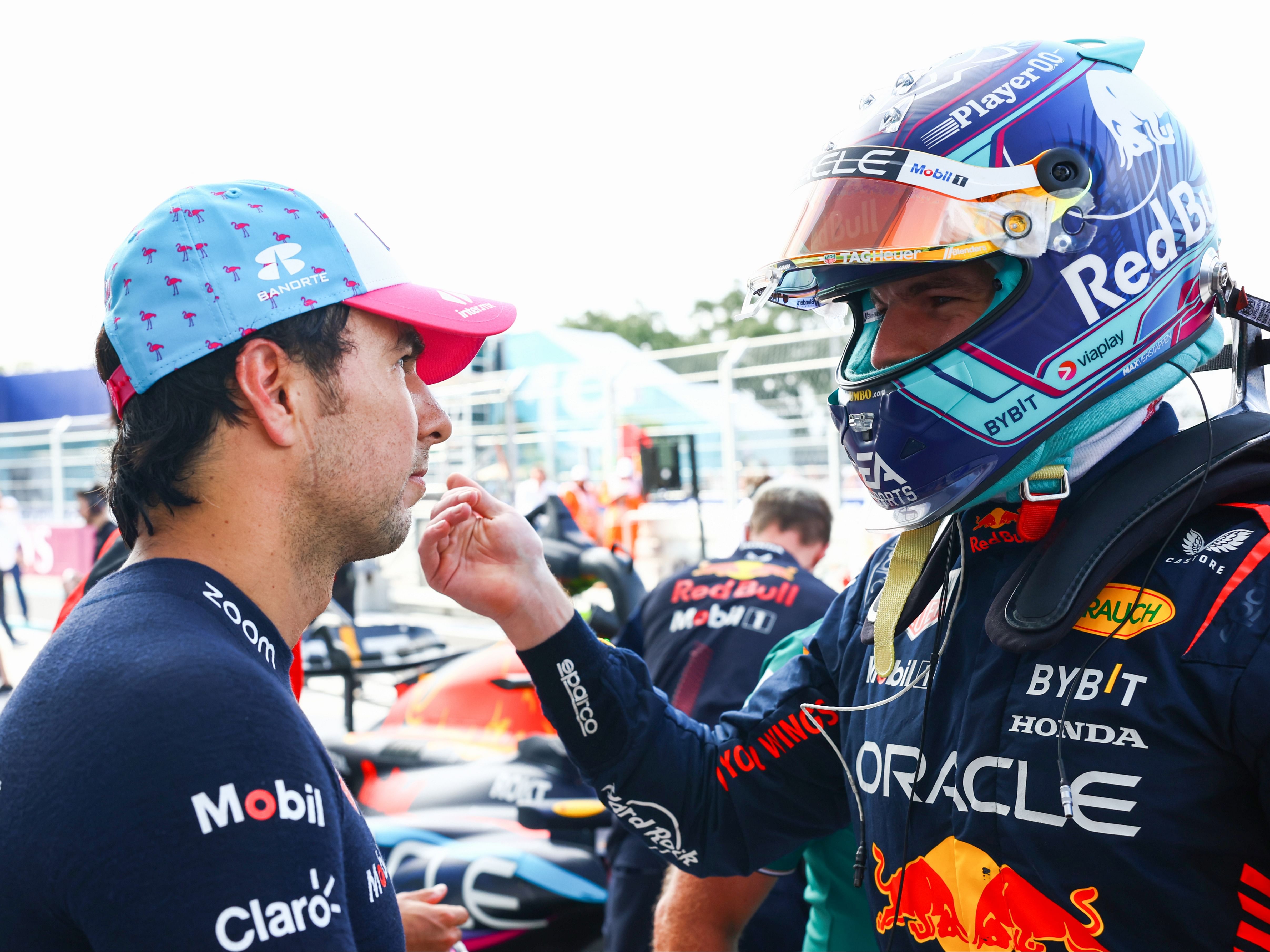 Sergio Perez and Max Verstappen talk in parc ferme during qualifying ahead of the 2023 F1 Miami Grand Prix. (Photo by Mark Thompson/Getty Images)