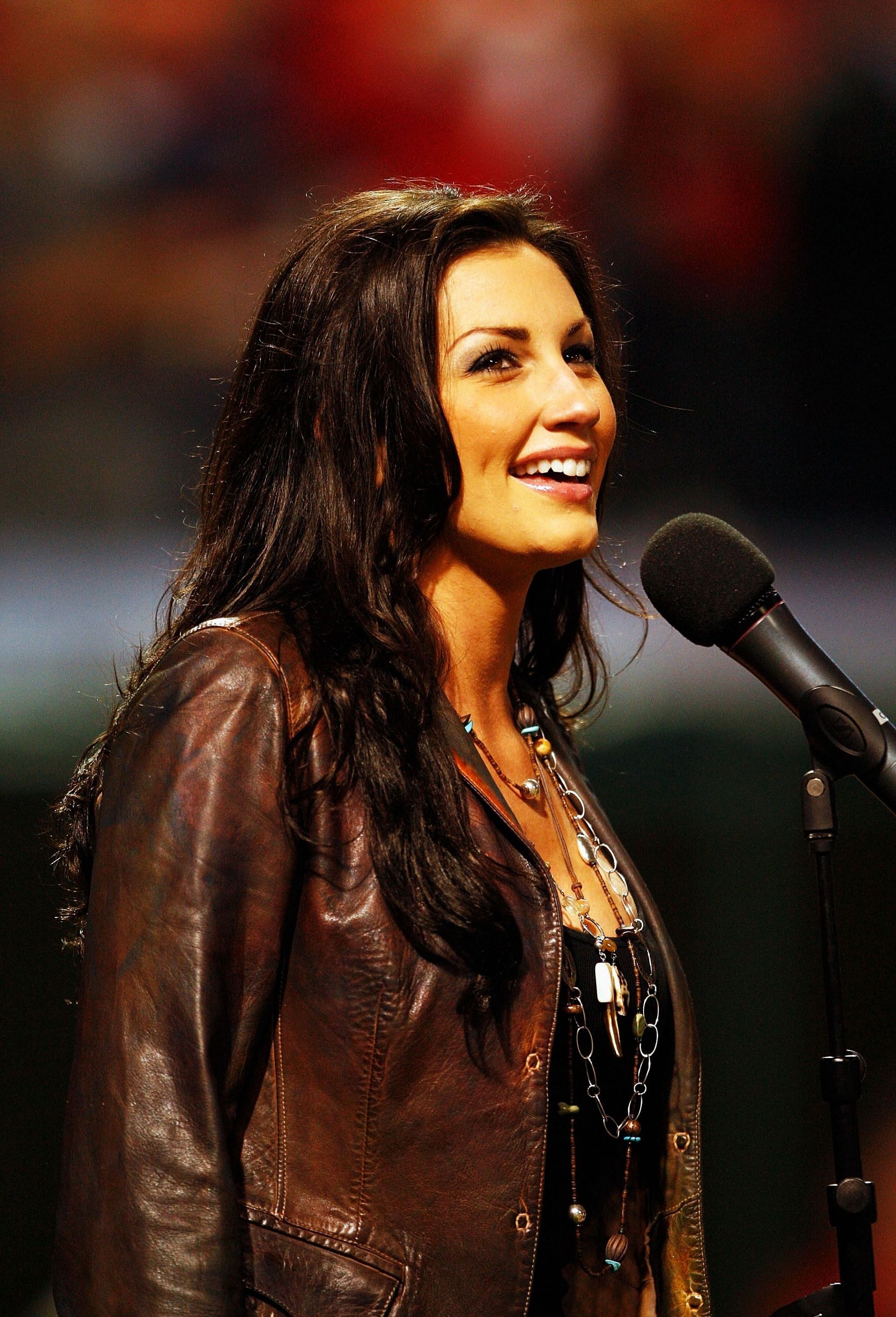 ALCS: Boston Red Sox v Cleveland Indians - Game 5: CLEVELAND - OCTOBER 18: Country music artist Danielle Peck performs the National Anthem before Game Five of the American League Championship Series between the Cleveland Indians and the Boston Red Sox at Jacobs Field on October 18, 2007, in Cleveland, Ohio. (Photo by Pool/Getty Images)