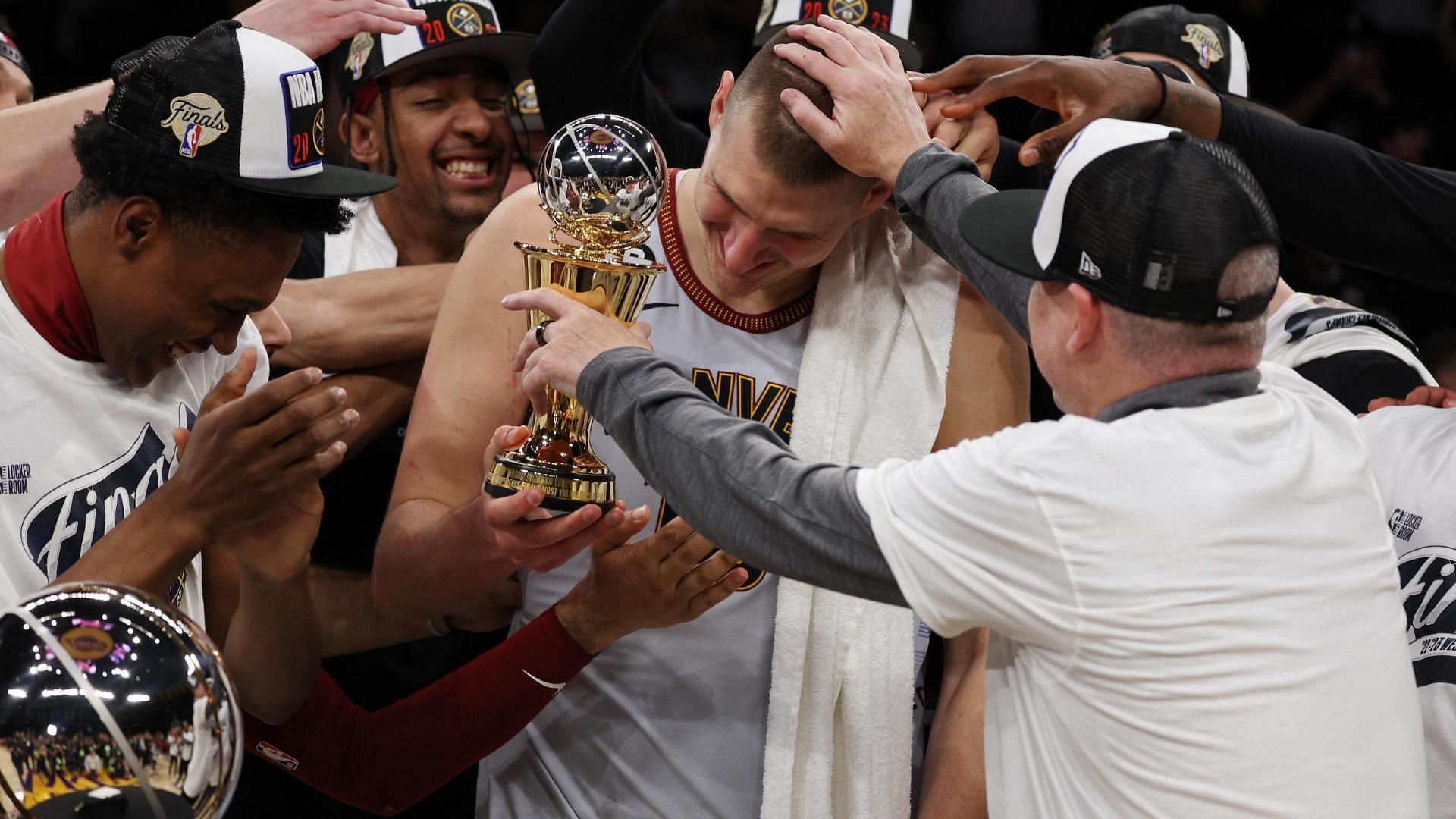 Denver Nuggets superstar center Nikola Jokic celebrating his Western Conference finals MVP award with his teammates