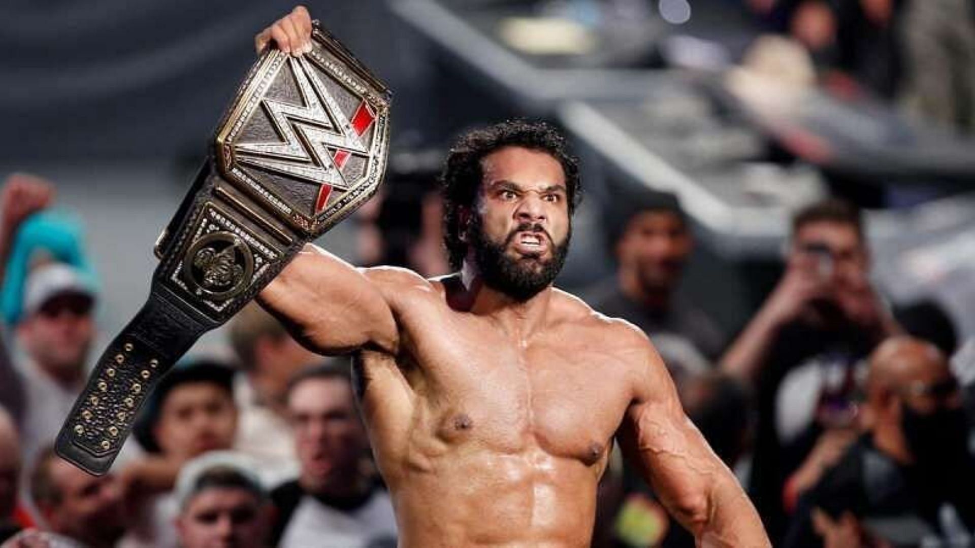 Jinder Mahal poses with the WWE Championship.