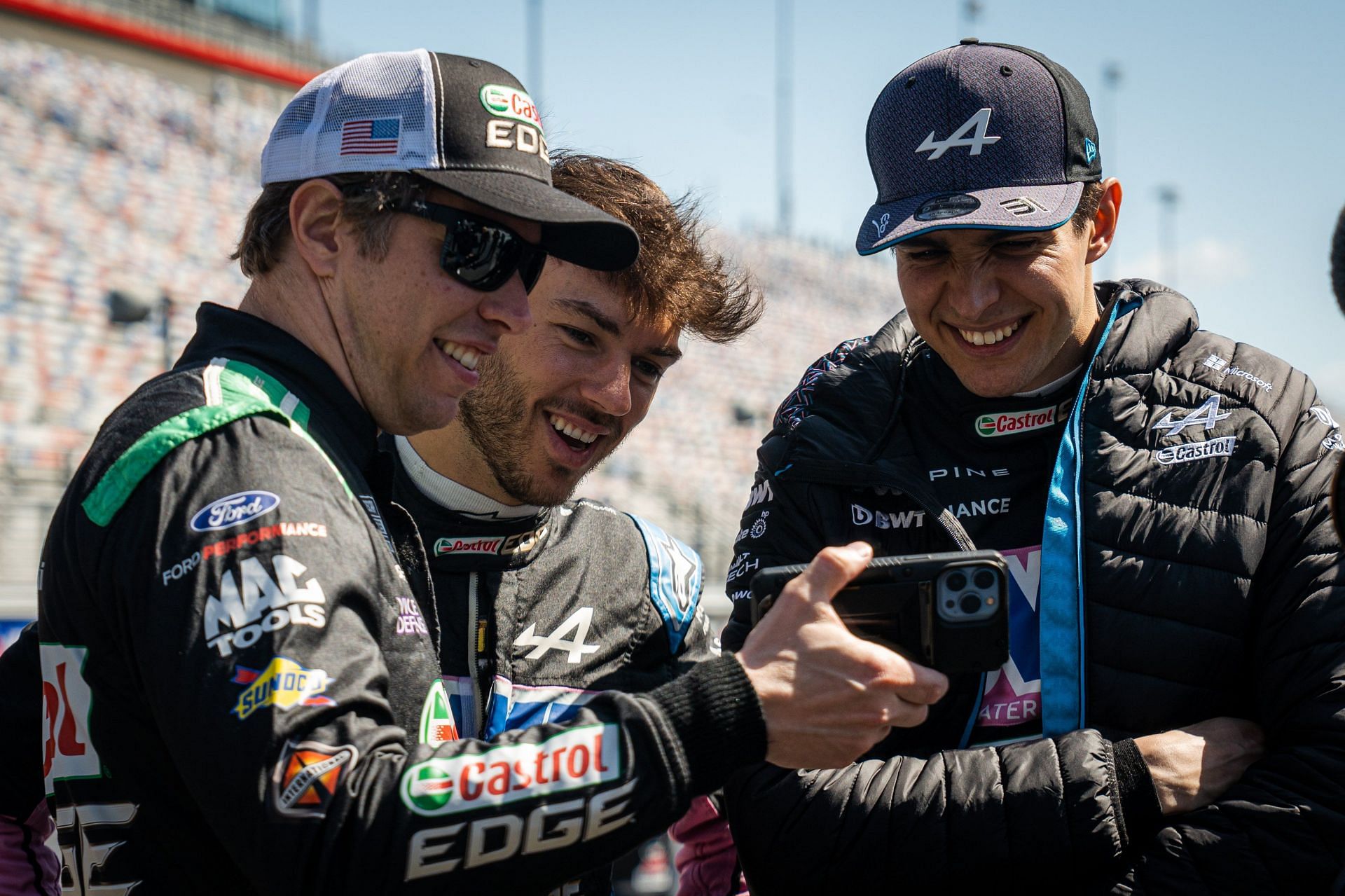 (L-R) NASCAR Cup Series driver Brad Keselowski with BWT Alpine F1 drivers Pierre Gasly and Esteban Ocon. Picture Credits: Brad Keselowski