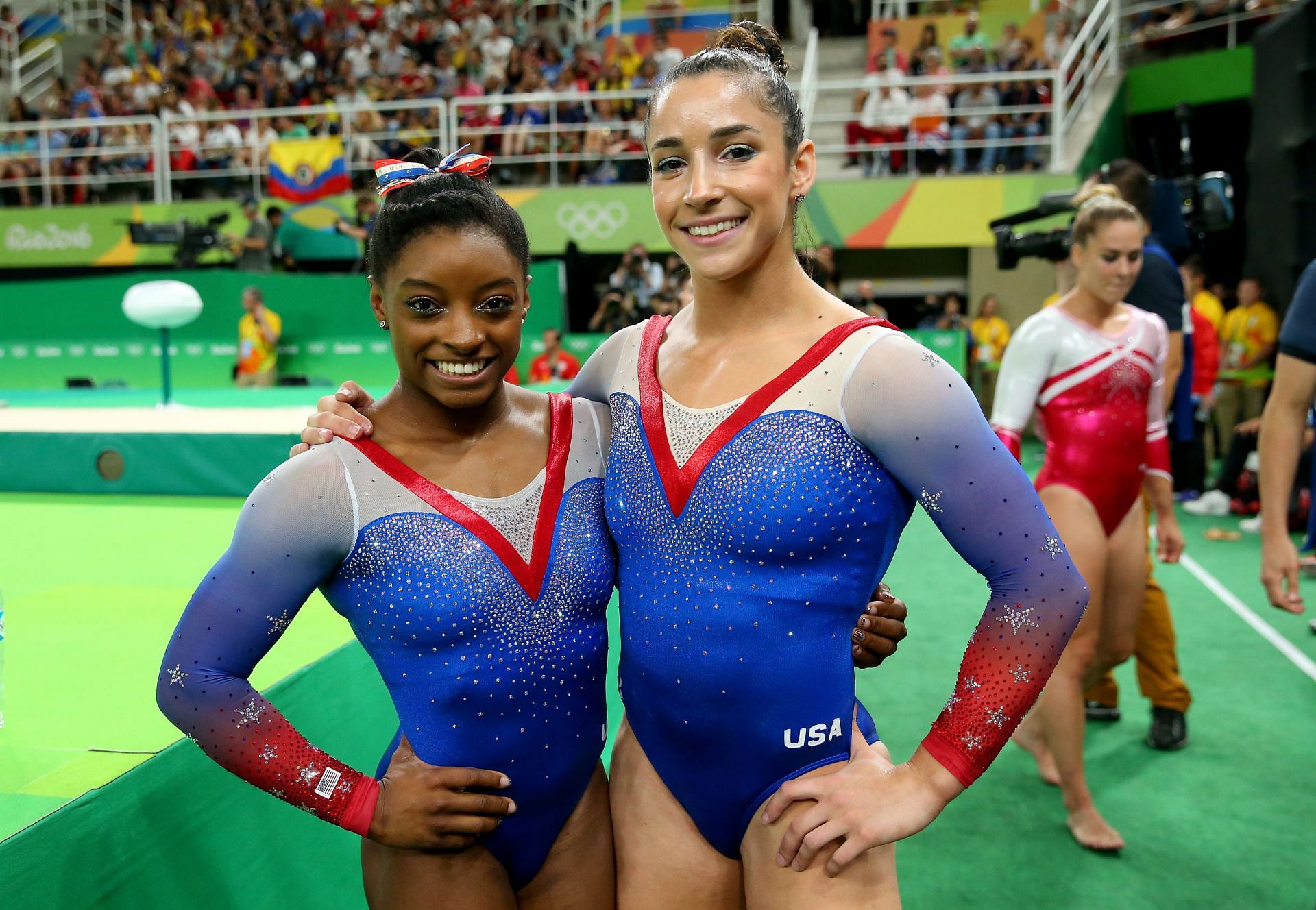 Simone Biles (L) and Alexandra Raisman (R) of the United States pose for photographs after competing on the Women&#039;s Floor Final on Day 11 of the Rio 2016 Olympic Games