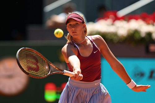 Mirra Andreeva in action at the Mutua Madrid Open - Day Eight.