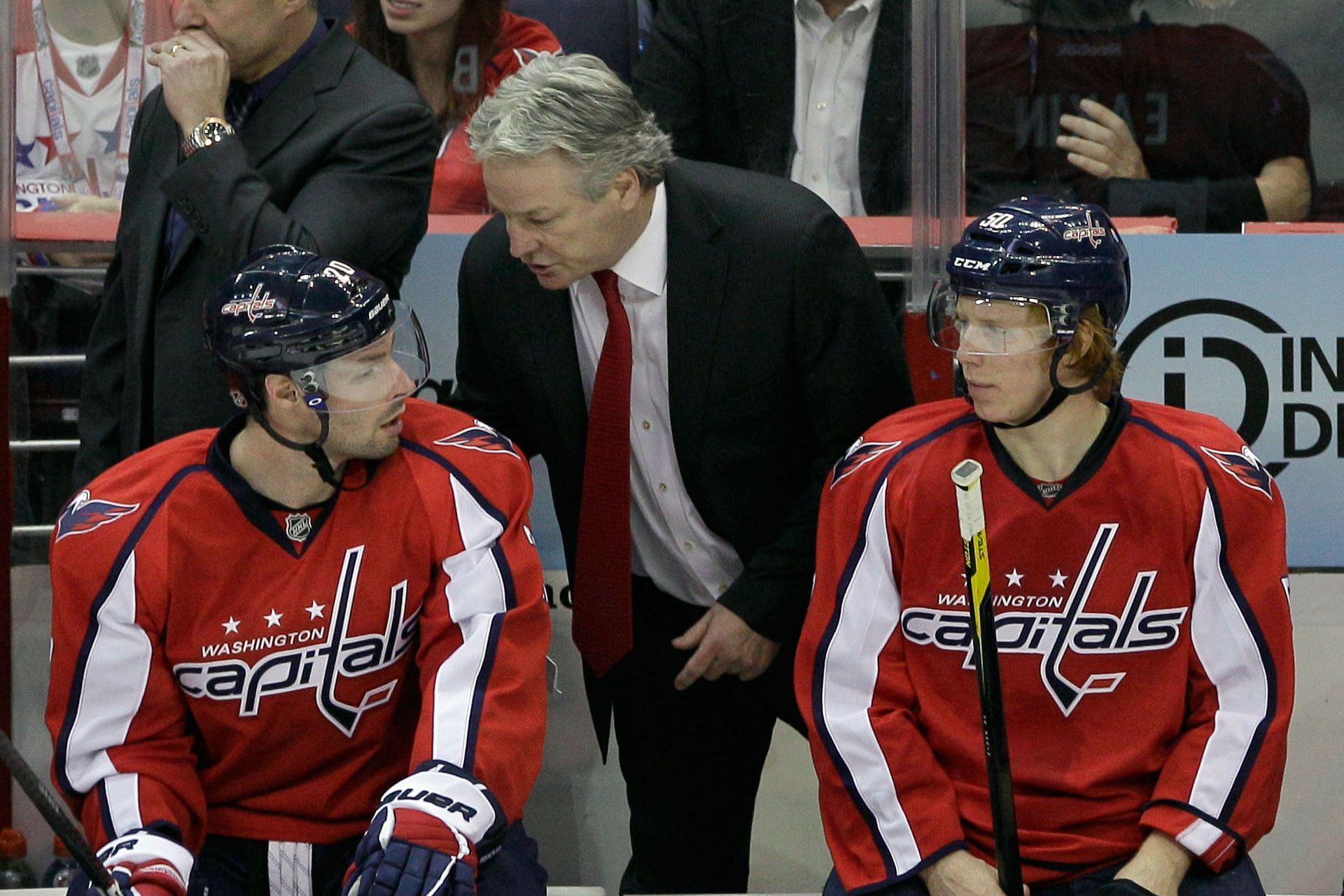 Head coach Dale Hunter of the Washington Capitals talks with Troy Brouwer #20 and Cody Eakin #50 during the third period against the Ottawa Senators at Verizon Center on December 3, 2011 in Washington, DC. (Photo by Rob Carr/Getty Images)