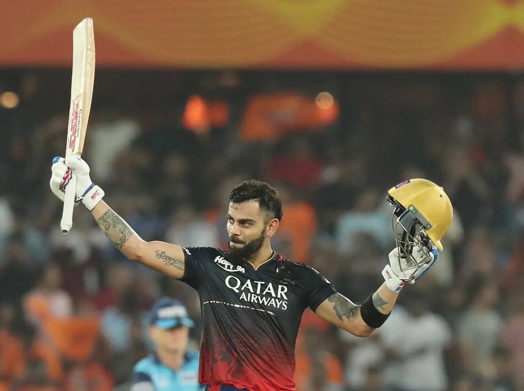 Virat Kohli raising his bat after a century [IPLT20]