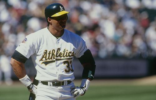 Jose Canseco of the Oakland Athletics looks on during the game against the Cleveland Indians at Oakland-Alameda County Coliseum on April 3, 1997, in Oakland, California. (Photo by Otto Greule Jr/Getty Images)