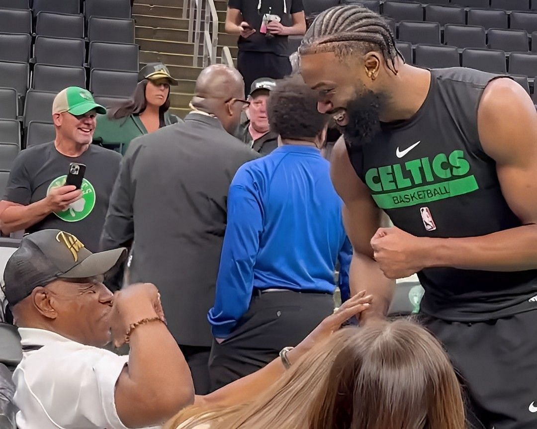 Boston Celtics star wing Jaylen Brown sharing a heartfelt moment with his grandfather ahead of Game 5 of the Eastern Conference finals against the Miami Heat