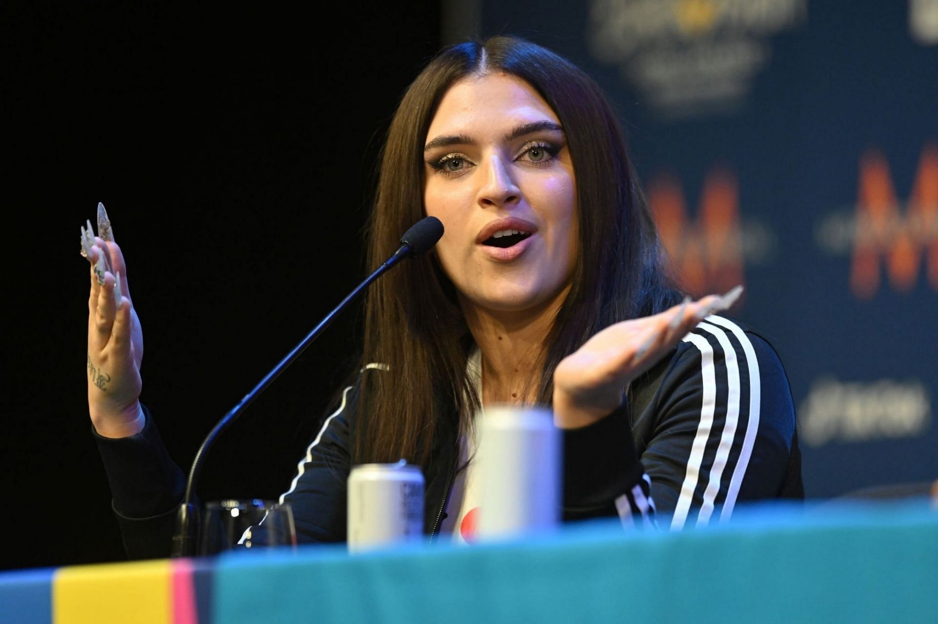  Mae Muller, representative for The United Kingdom, during the Big 5 and Ukraine Media Conference for the Eurovision Song Contest 2023 at M&amp;S Bank Arena on May 12, 2023 in Liverpool, England.(Image via Getty Images)