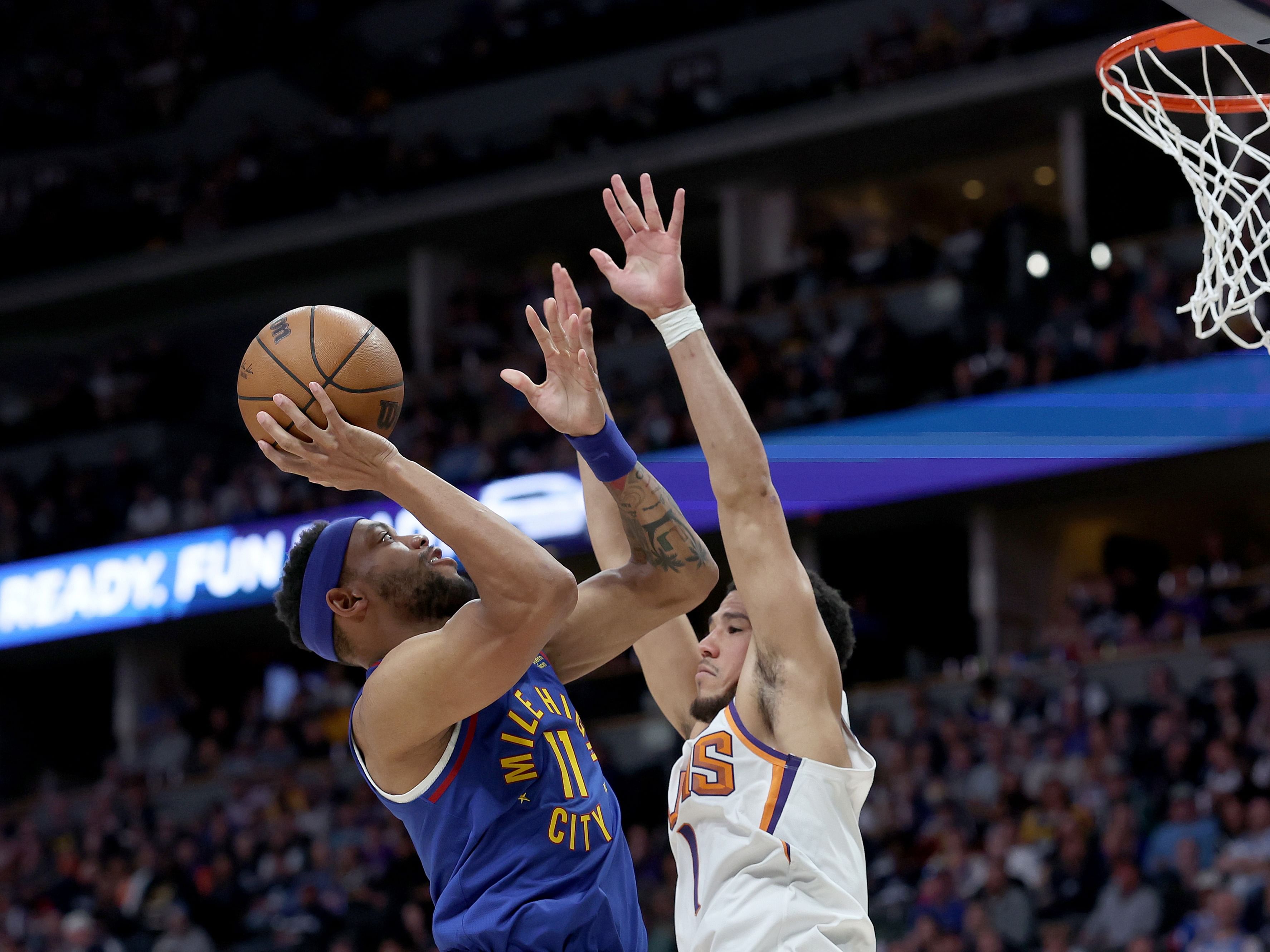 Bruce Brown and Devin Booker in action 