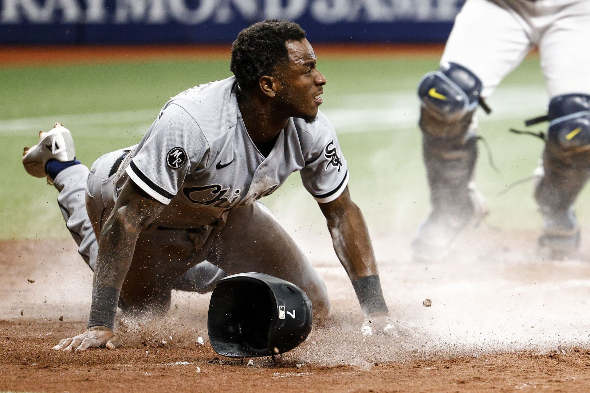 Chicago White Sox v Tampa Bay Rays: ST PETERSBURG, FLORIDA - AUGUST 20: Tim Anderson #7 of the Chicago White Sox slides safely into home plate on a fielders choice from the bat of Jose Abreu #79 during the fifth inning against the Tampa Bay Rays at Tropicana Field on August 20, 2021 in St Petersburg, Florida. (Photo by Douglas P. DeFelice/Getty Images)