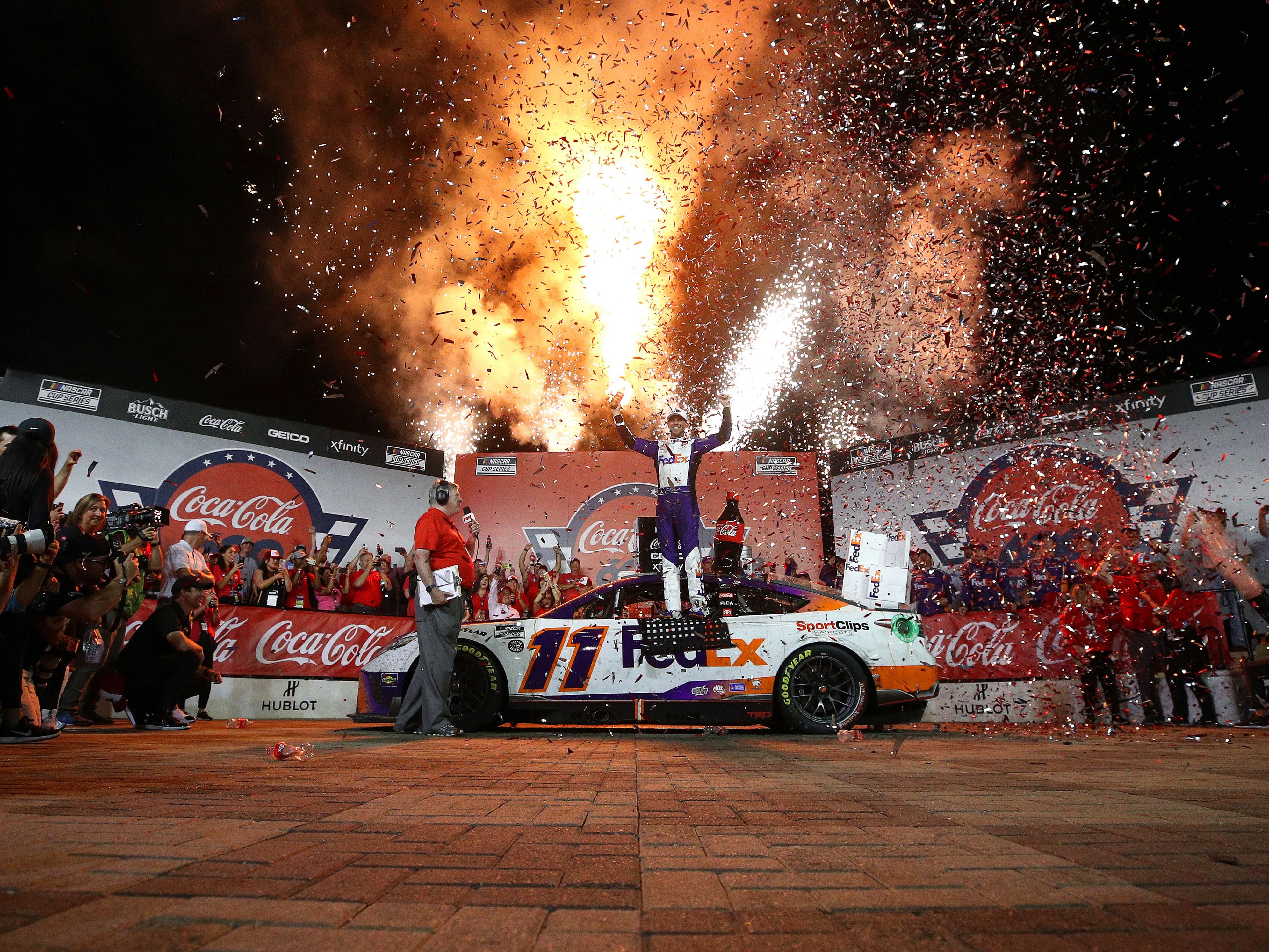 Denny Hamlin celebrates in Victory Lane after winning the 2022 NASCAR Cup Series Coca-Cola 600 at Charlotte Motor Speedway in Concord, North Carolina. (Photo by Jared C. Tilton/Getty Images)
