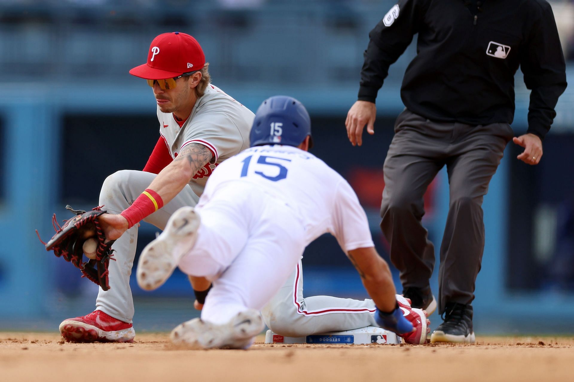 Bryson Stott #5 of the Philadelphia Phillies gets the out at second base on Austin Barnes #15 of the Los Angeles Dodgers