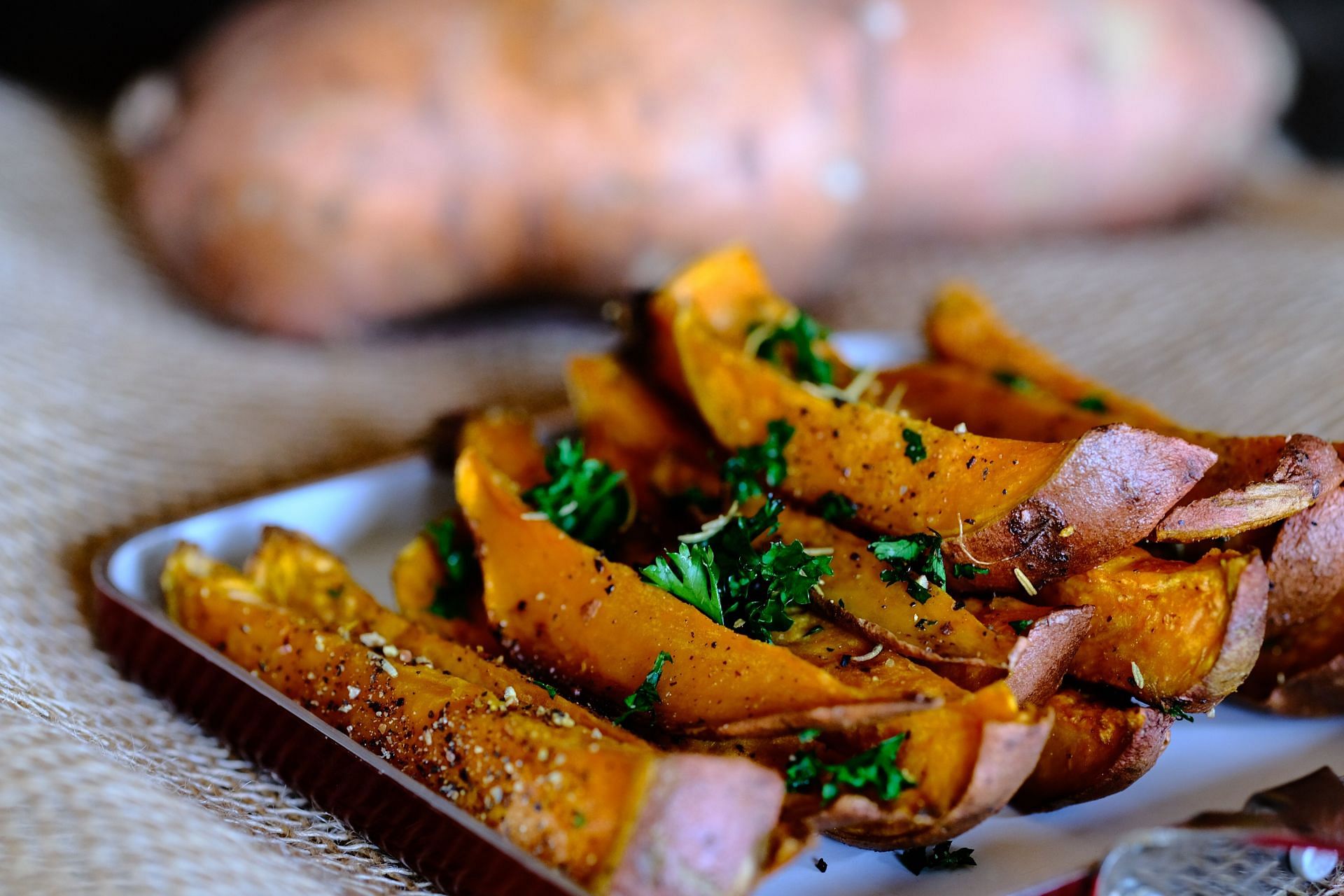 sweet potatoes can help you feel satisfied and full. (image via unsplash / rajesh)