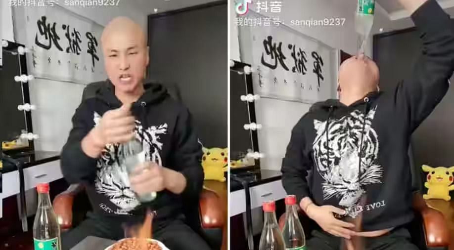 Sanqiange chugging alcohol in live streaming. (Image via Douyin)
