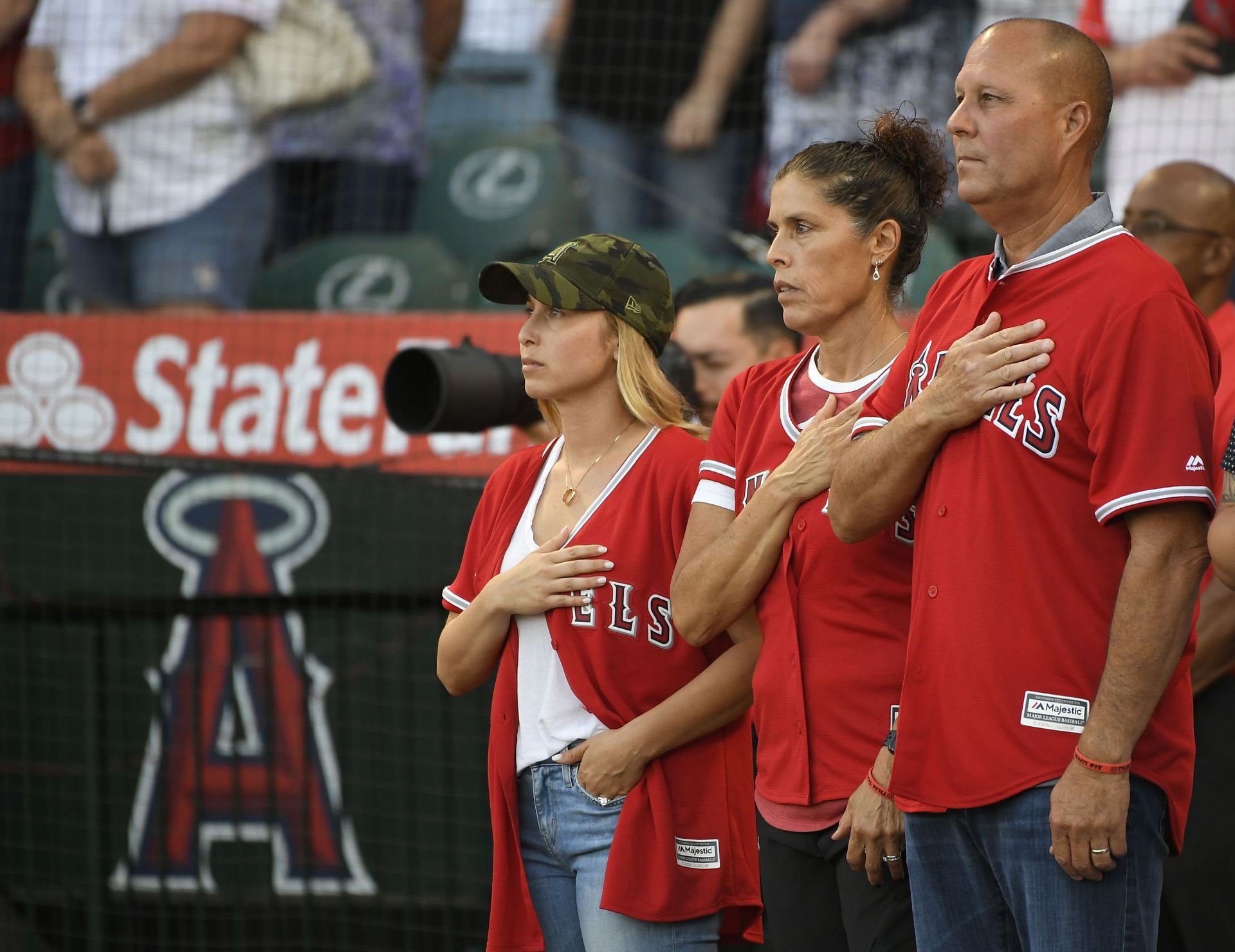 Seattle Mariners v Los Angeles Angels of Anaheim: ANAHEIM, CA - JULY 12: Tyler Skaggs wife Carli Skaggs, his mother Debbie Hetman stand next to step father Danny Hetman during the National Anthem before the Los Angeles Angels of Anaheim play the Seattle Mariners at Angel Stadium of Anaheim on July 12, 2019 in Anaheim, California. (Photo by John McCoy/Getty Images)
