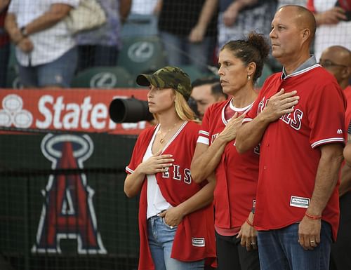 Seattle Mariners v Los Angeles Angels of Anaheim: ANAHEIM, CA - JULY 12: Tyler Skaggs wife Carli Skaggs, his mother Debbie Hetman stand next to step father Danny Hetman during the National Anthem before the Los Angeles Angels of Anaheim play the Seattle Mariners at Angel Stadium of Anaheim on July 12, 2019 in Anaheim, California. (Photo by John McCoy/Getty Images)