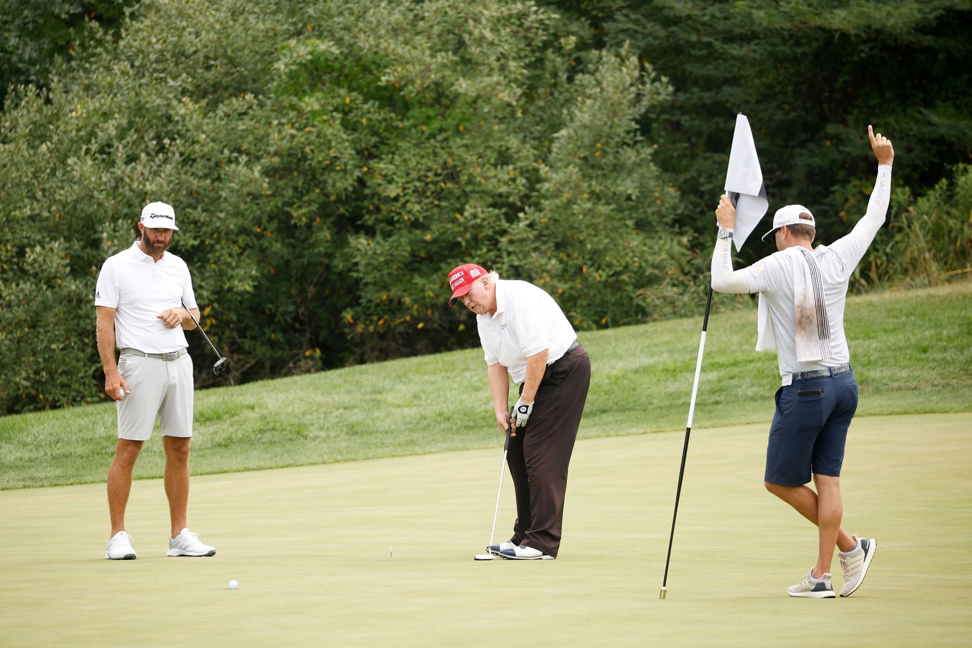 Donald Trump playing at the LIV Golf Invitational (Image via Getty)