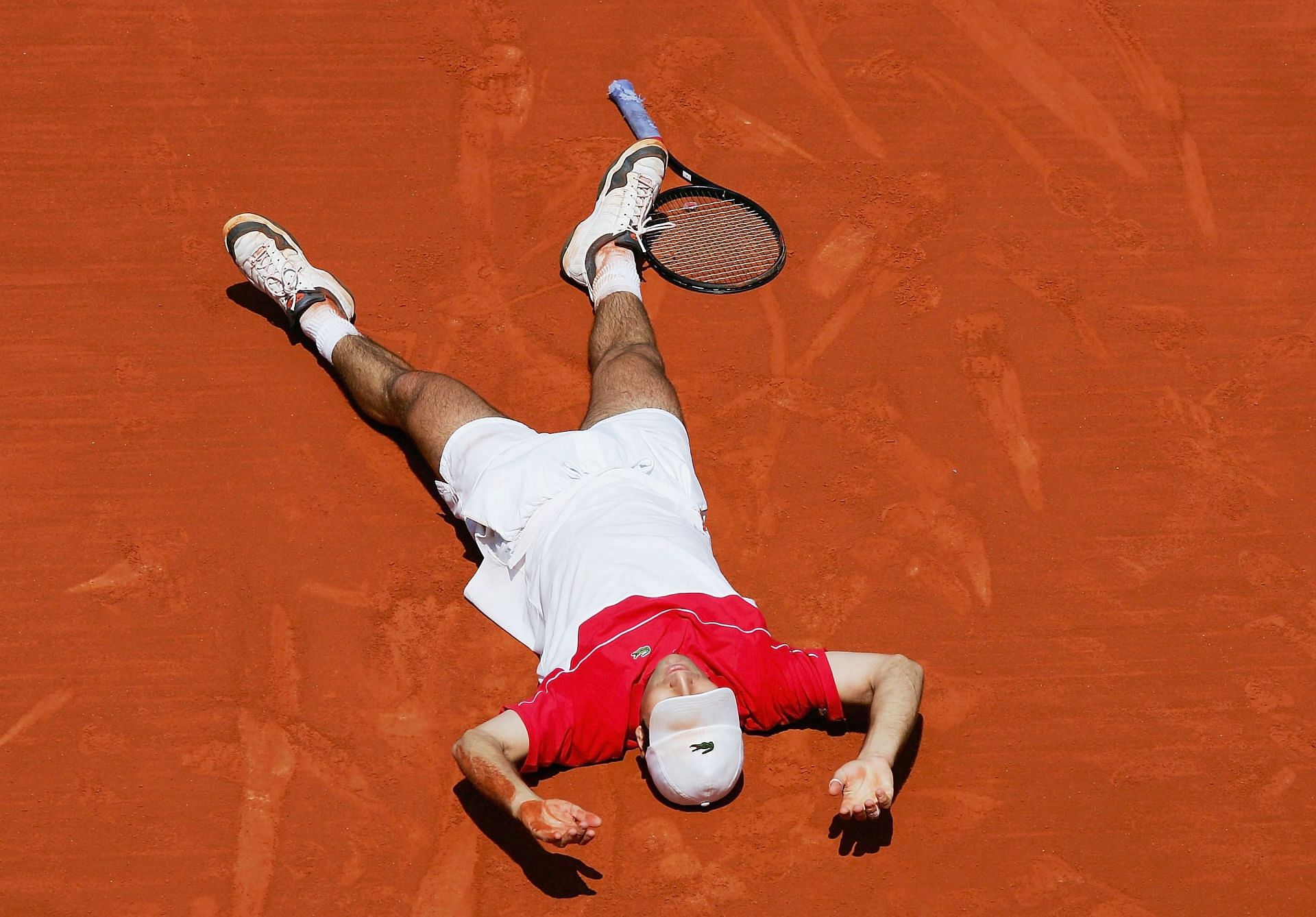 Fabrice Santoro celebrating his win over Arnaud Clement at the 2004 French Open.