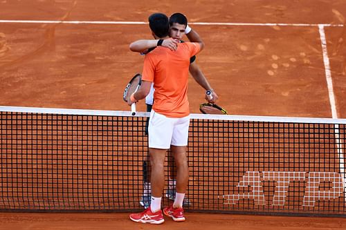 Carlos Alcaraz and Novak Djokovic after their match at the Madrid Open in 2022