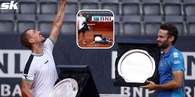 Rain pelts Italian Open men's doubles trophy presentation, Hugo Nys and Jan Zielinski celebrate through showers with mock-swimming celebration