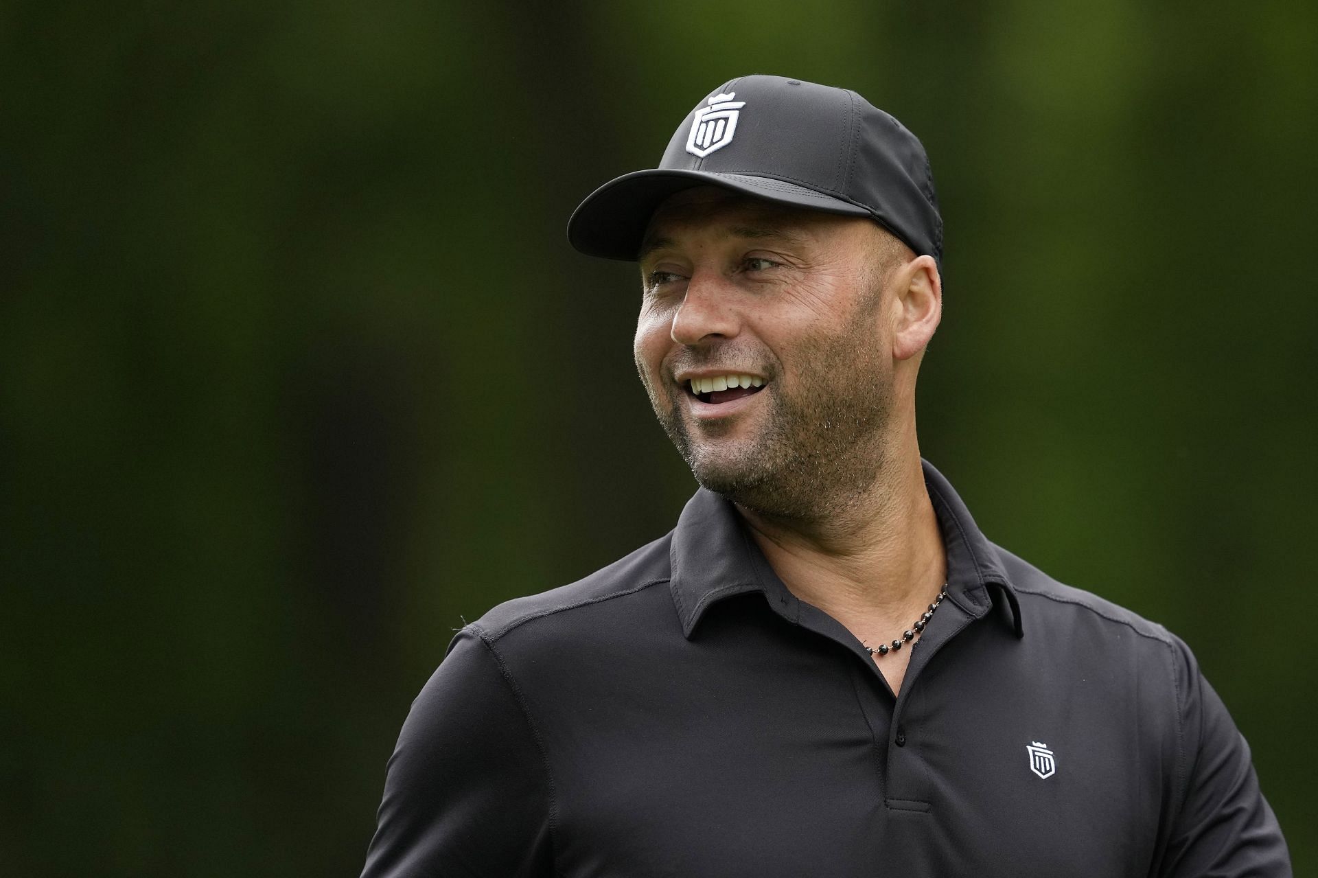 Former MLB player Derek Jeter walks off the 11th tee box during the American Family Insurance Championship at University Ridge Golf Club