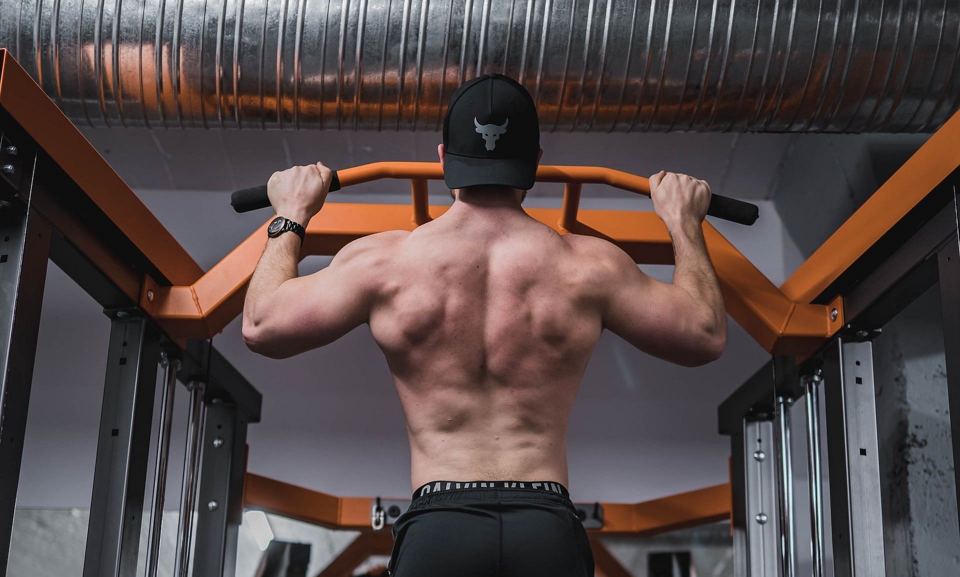 Kipping pull ups (Photo by Anastase Maragos on Unsplash)