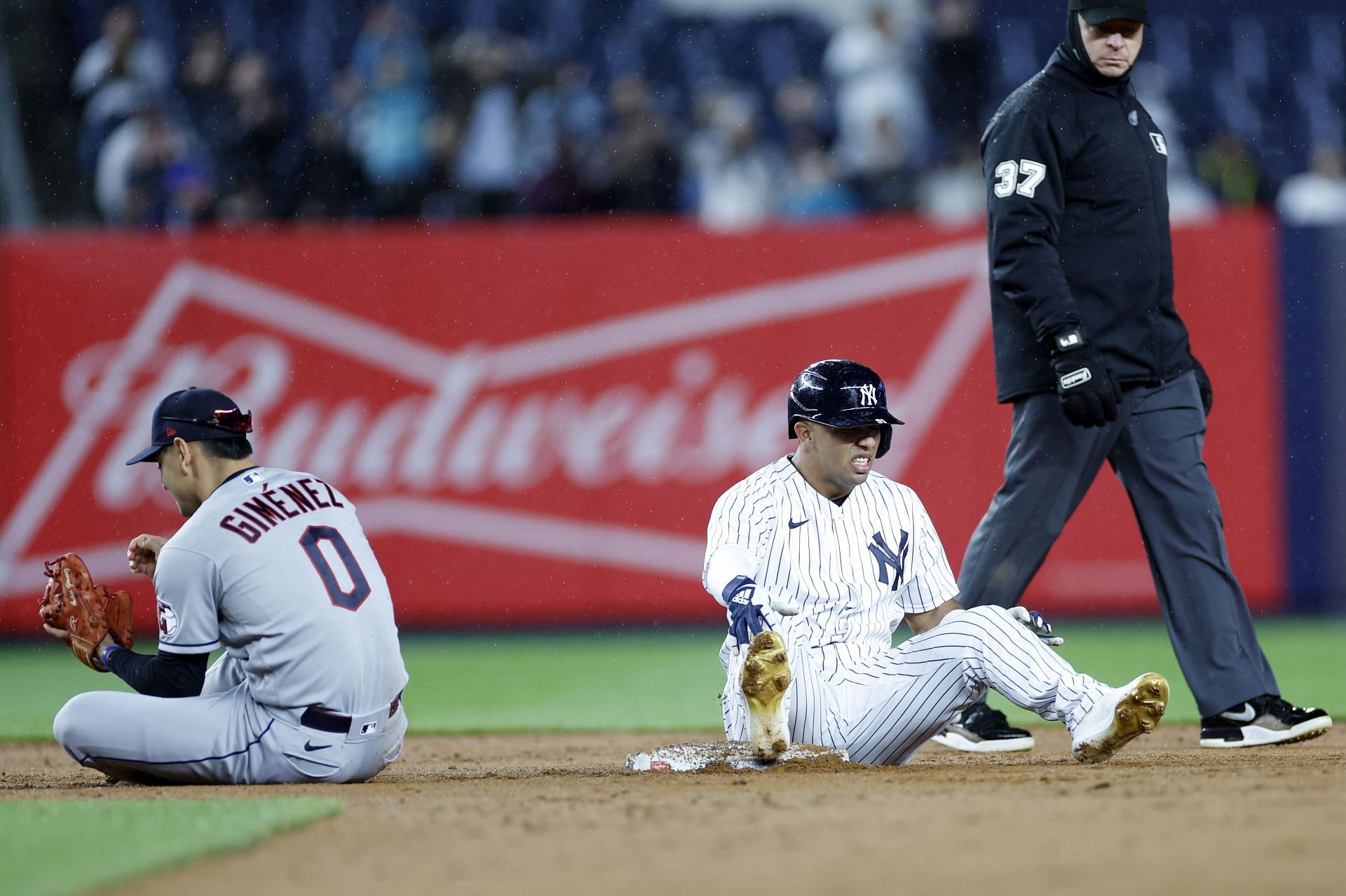 Oswald Peraza #91 of the New York Yankees and Andres Gimenez #0 of the Cleveland Guardians react after a play at second base during the ninth inning at Yankee Stadium