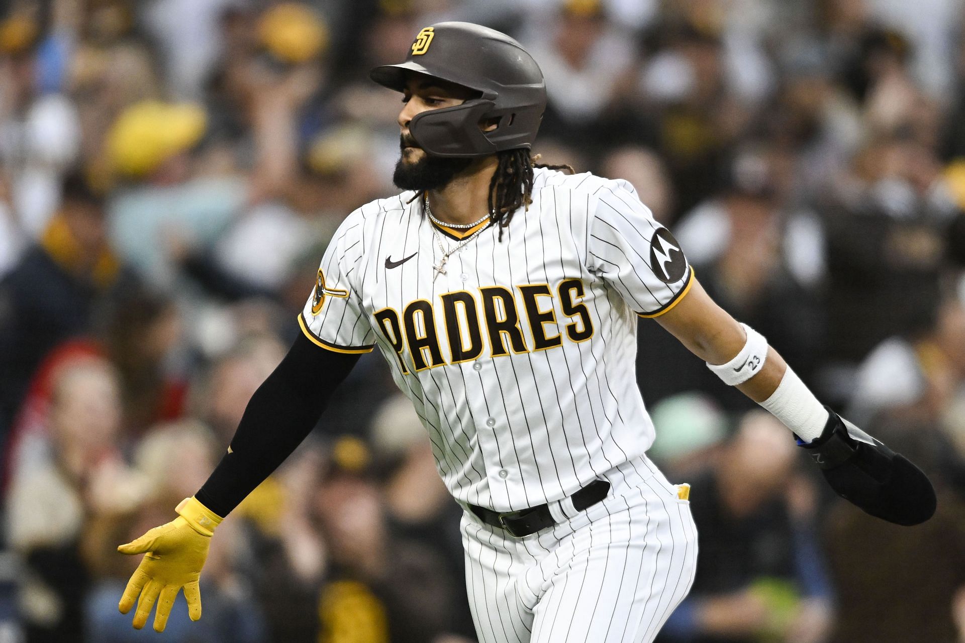 Fernando Tatis Jr. #23 of the San Diego Padres scores in the first inning