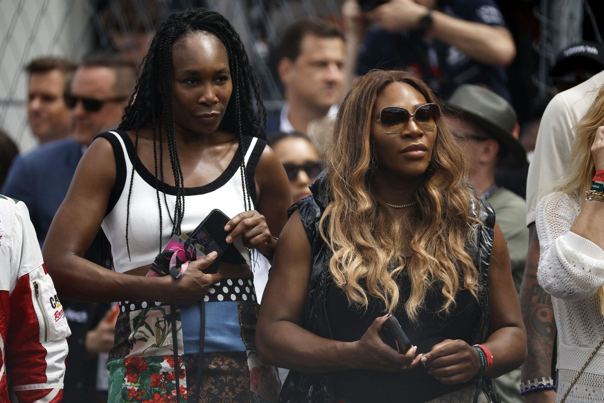 Venus Williams (L) and Serena Williams at the F1 Miami Grand Prix.