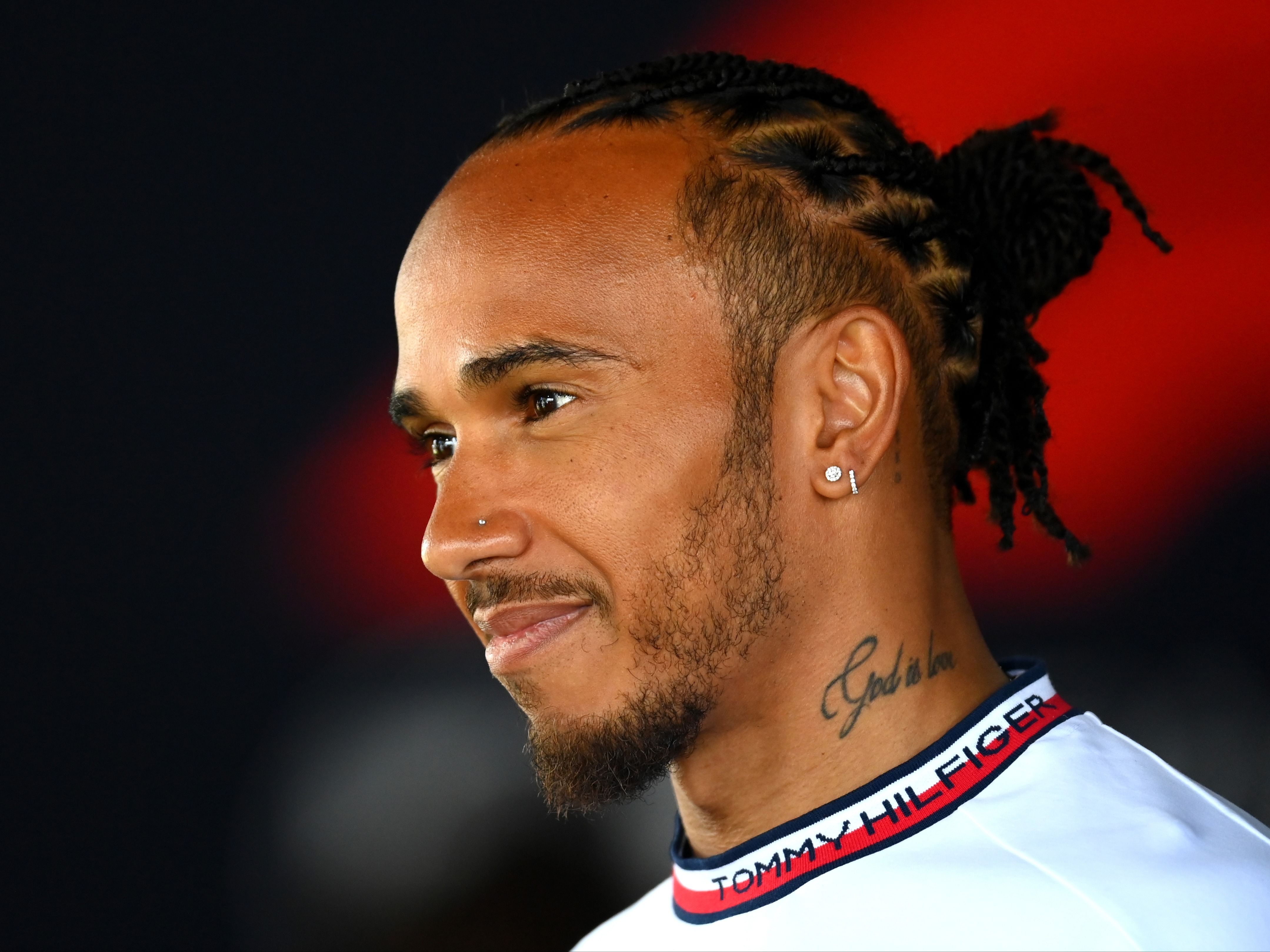 Lewis Hamilton talks to the media in the paddock during previews ahead of the 2023 F1 Australian Grand Prix. (Photo by Quinn Rooney/Getty Images)