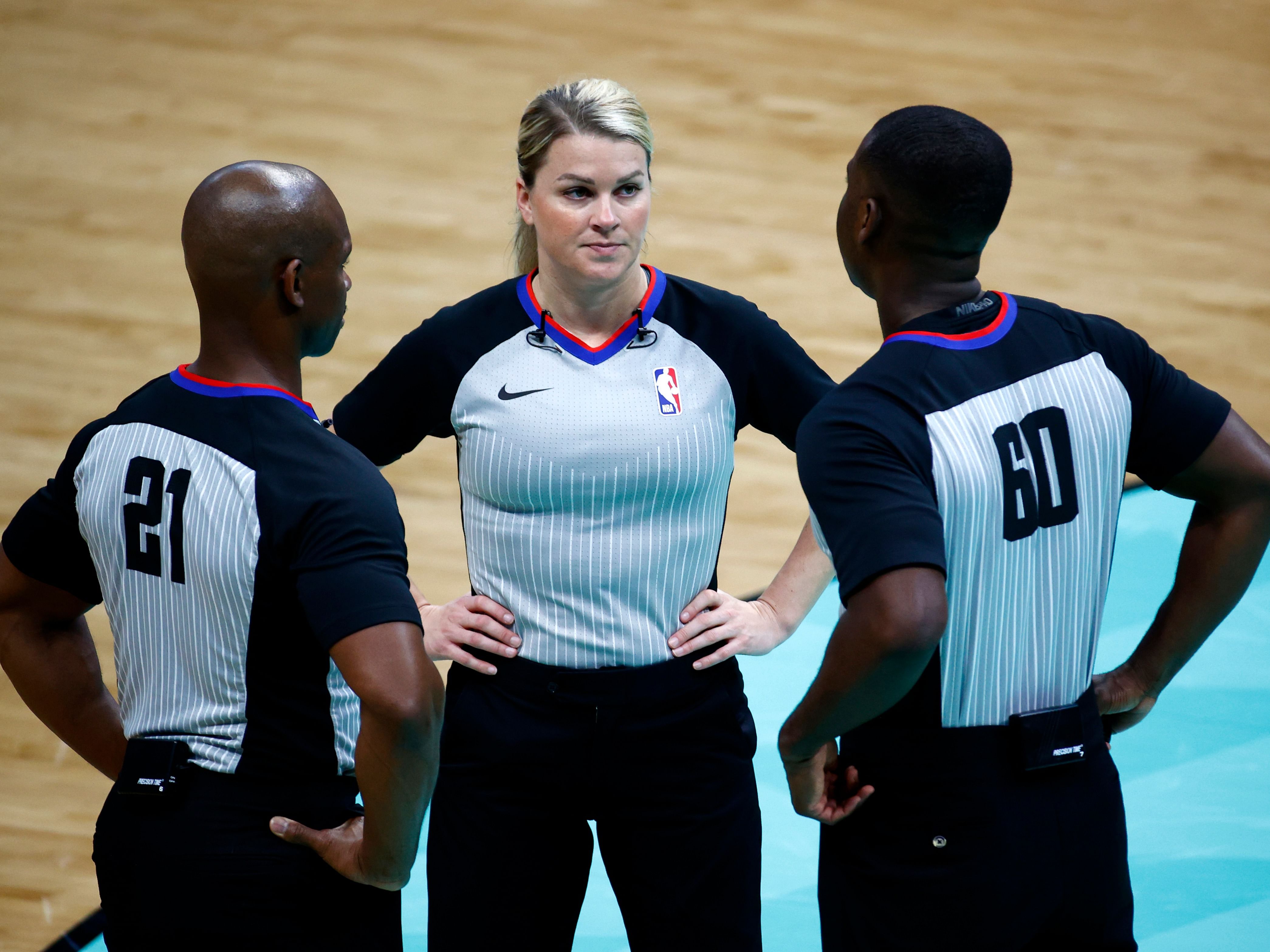 NBA referees during a game between the Denver Nuggets and Charlotte Hornets