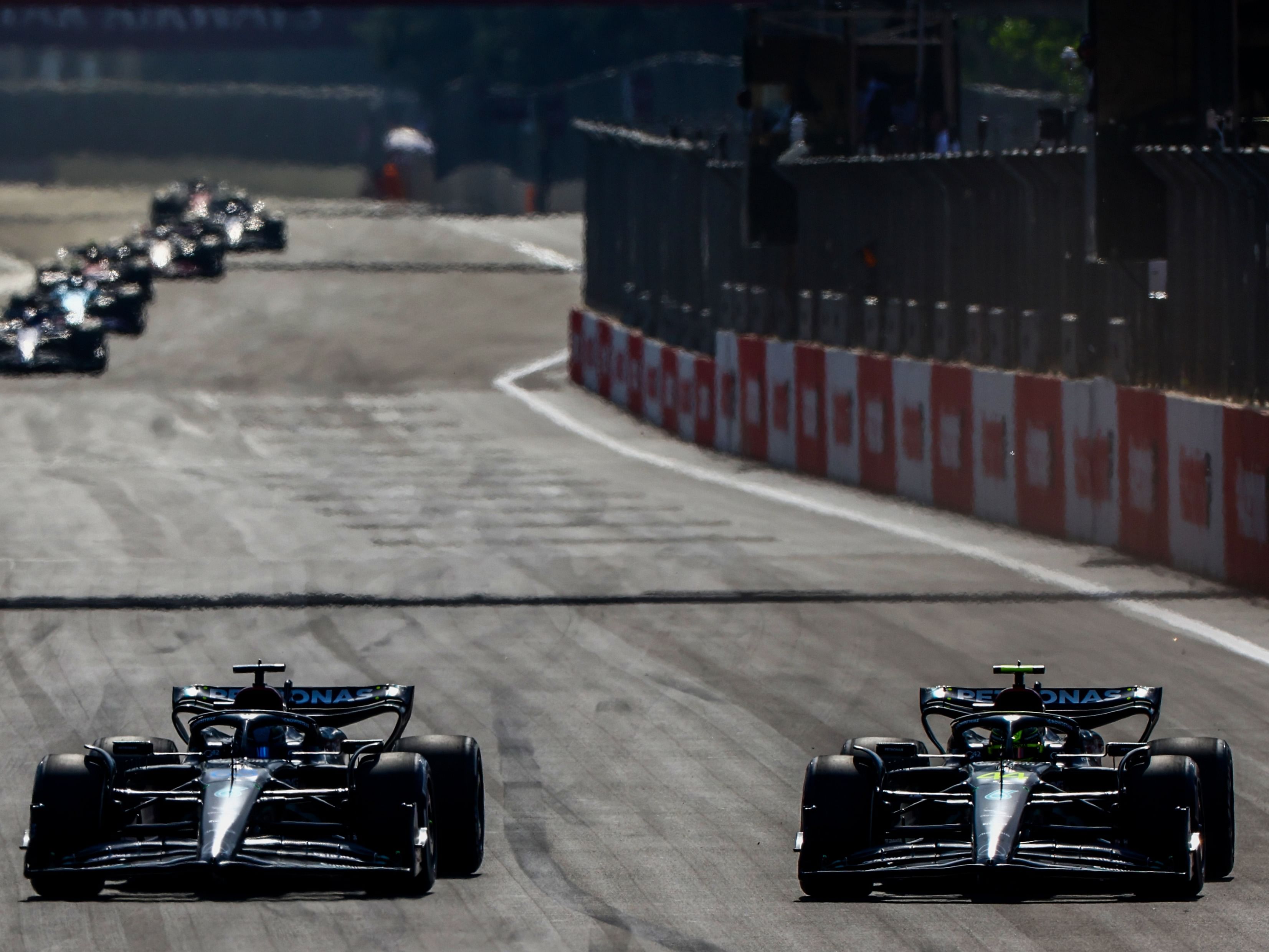 F1 Grand Prix of AzerbaijanGeorge Russell (63) and Lewis Hamilton (44) on track during the 2023 F1 Azerbaijan Grand Prix. (Photo by Mark Thompson/Getty Images)