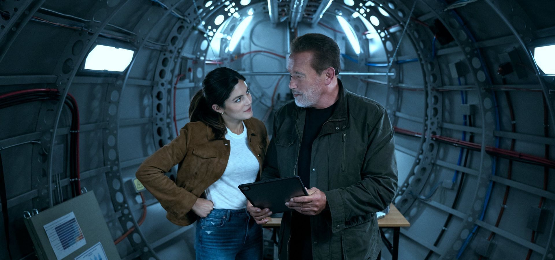 Monica Barbaro and Arnold Schwarzenegger in FUBAR (Image via Twitter/@Netflix)