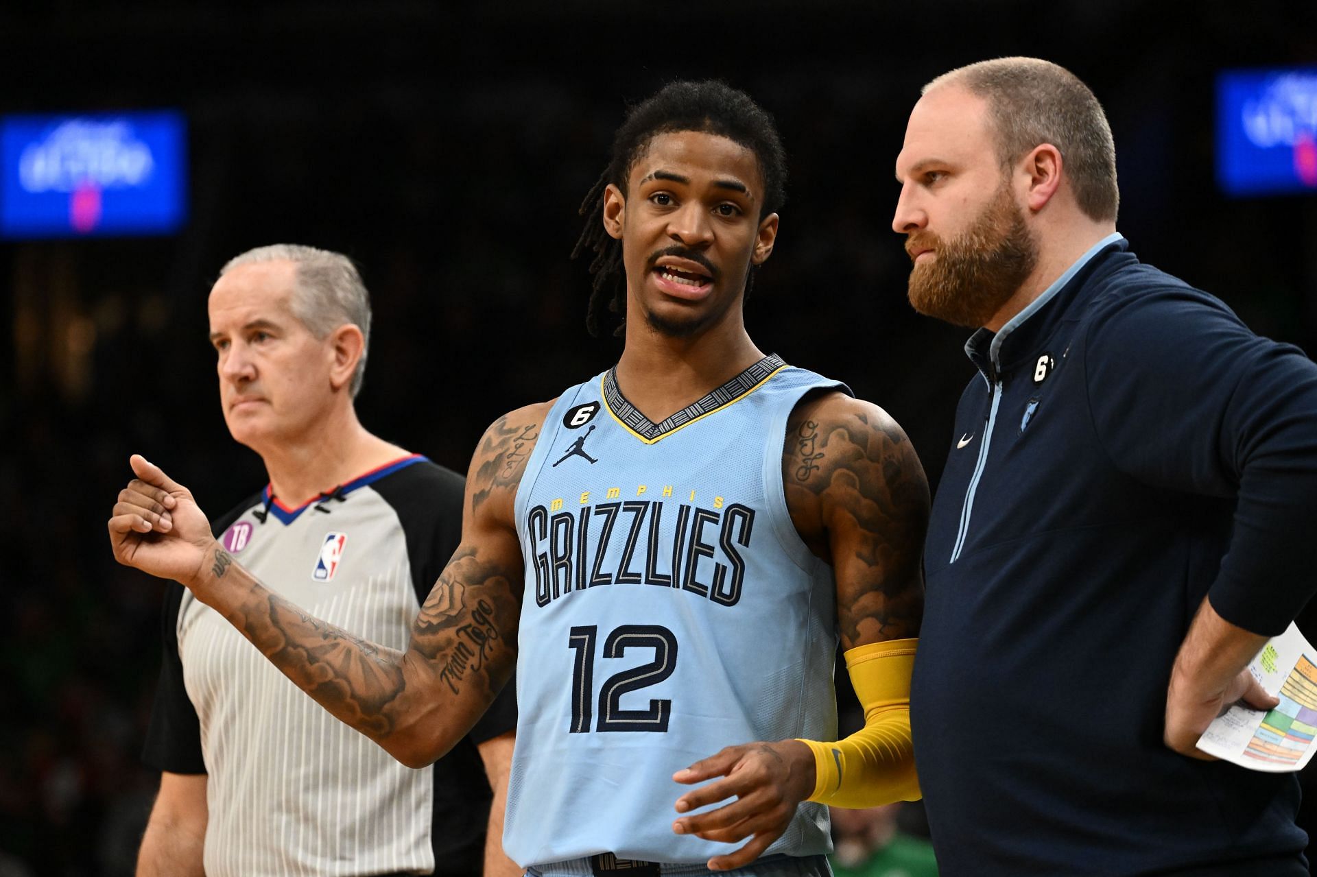 Ja Morant of the Memphis Grizzlies talks with head coach Taylor Jenkins