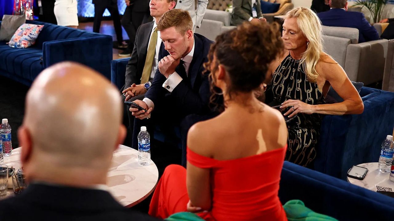 Levis and Duddy (in red dress) in the green room of the NFL Draft. Credit: Getty Images