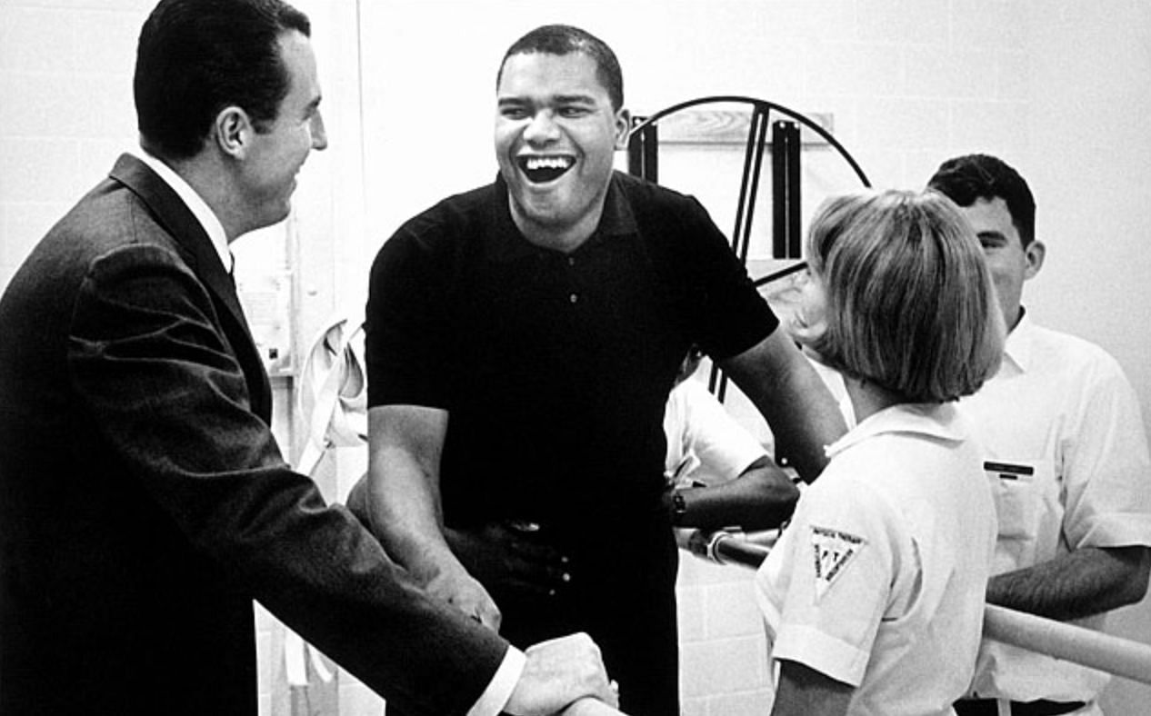 Maurice Stokes (center) and teammate Jack Twyman (left) after horrific injury