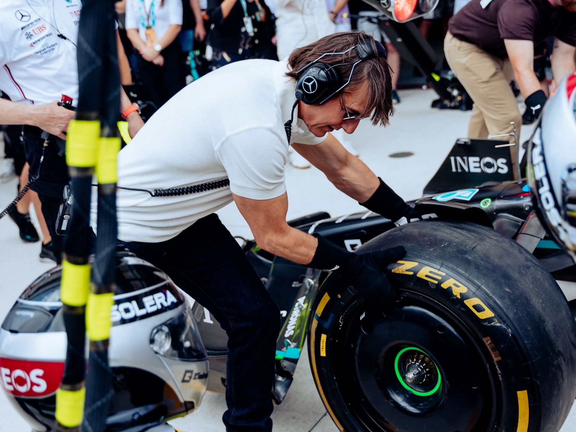 Tom Cruise performs a pit stop as a pit crew at the Mercedes garage prior to the 2023 F1 Miami GP (Image via Twitter/@MercedesAMGF1)