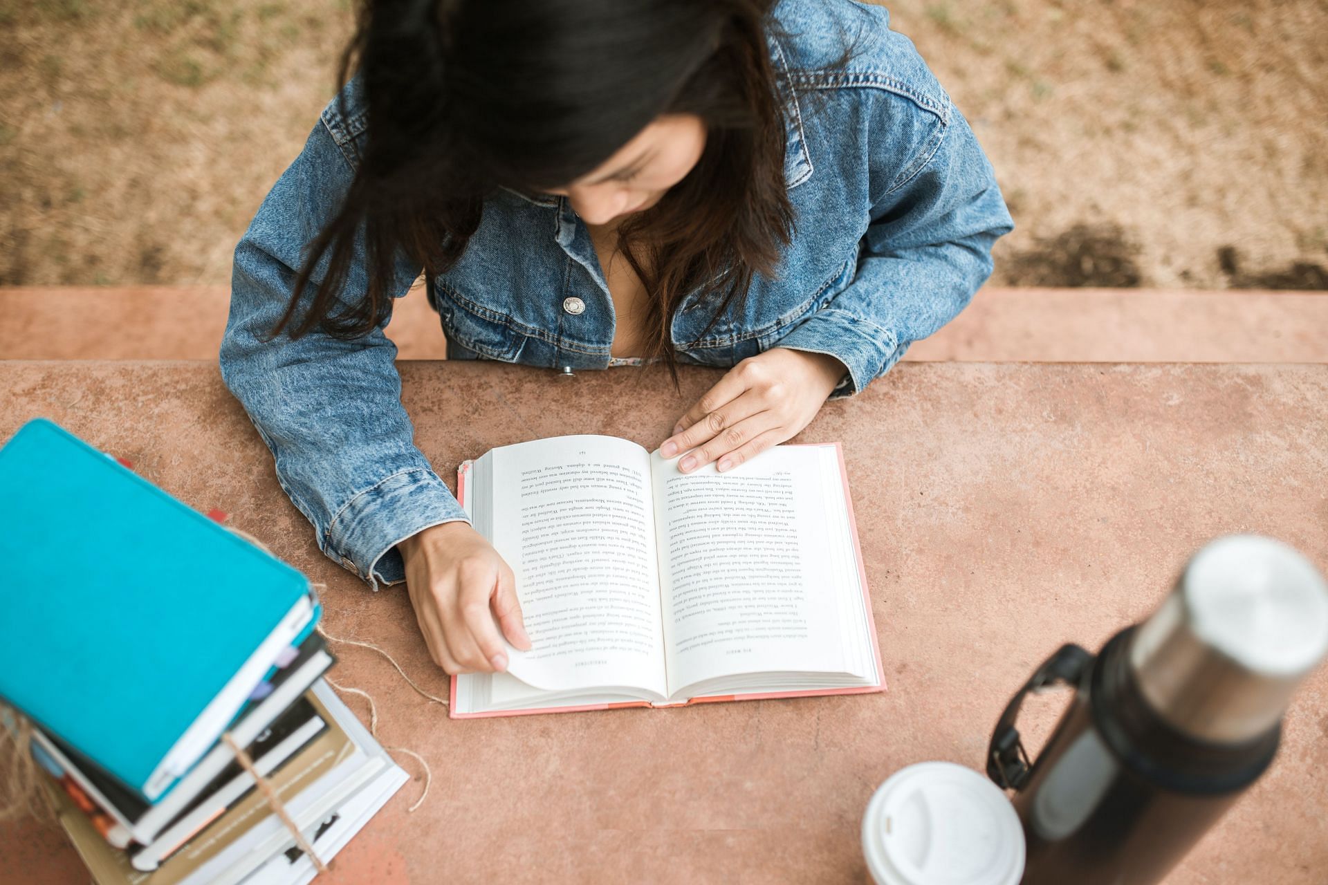 Reading a book in 75 Hard Challenge. (Image via Pexels/ Rdne Stock Project)