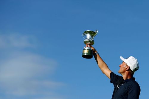 Adrian Meronk lifting his 2023 Italian Open champion trophy (Image via Getty). 