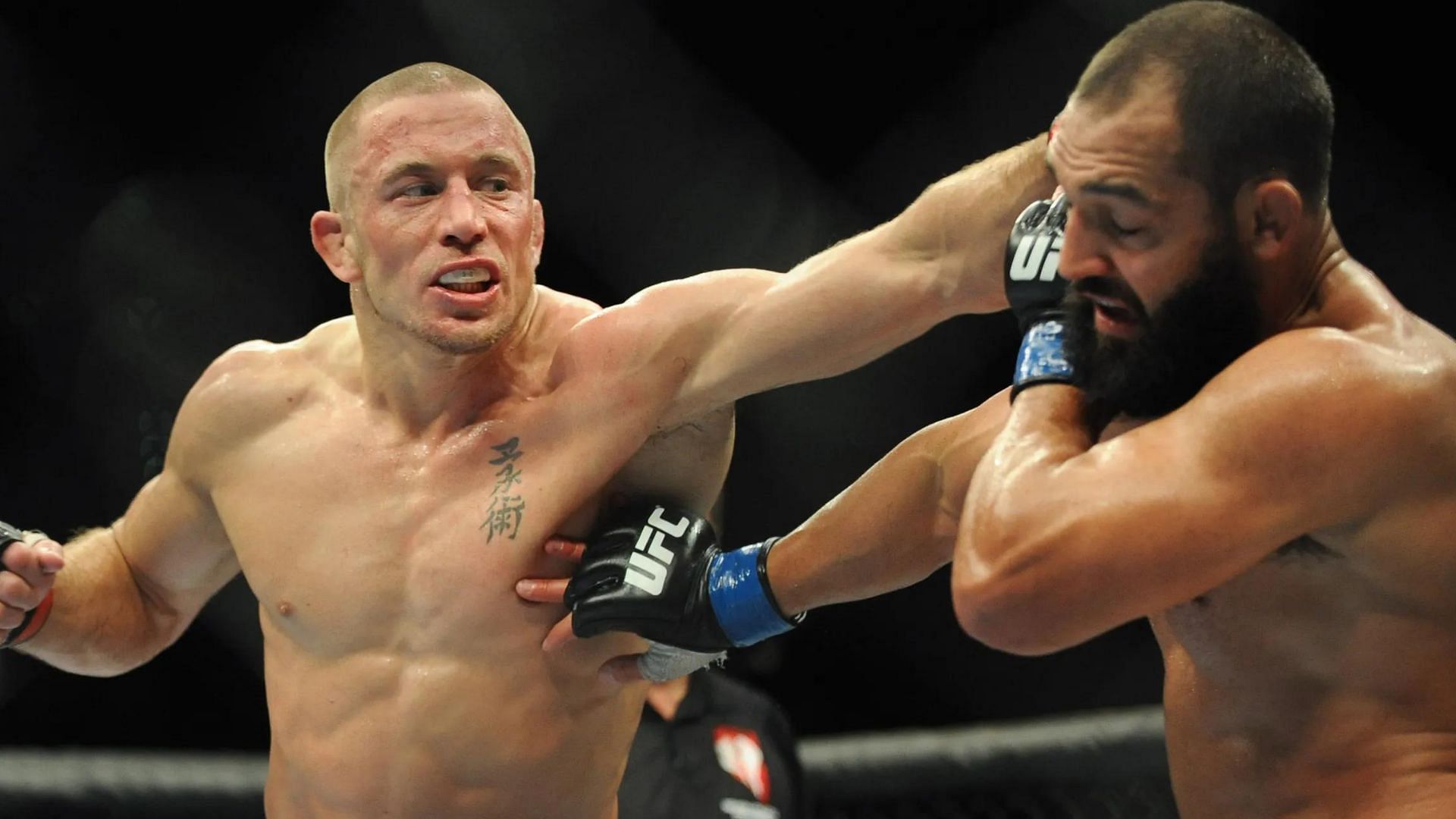 Georges St-Pierre (left), Johny Hendricks (right) [Image courtesy USA Today]