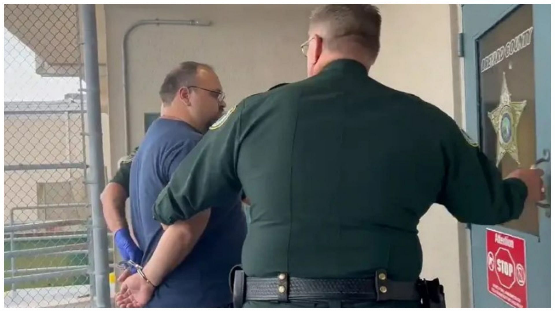 Police arresting Cohen on charges of possessing child porn (Screengrab via video posted to Brevard County Sheriff