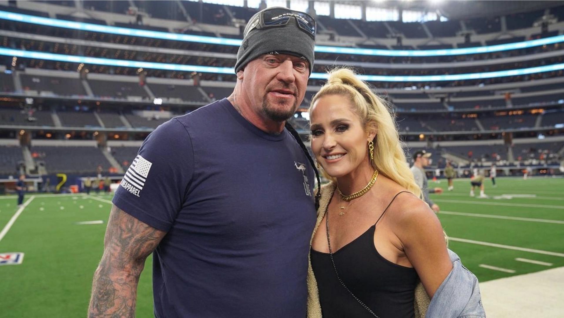 The Undertaker and Michelle McCool at a game