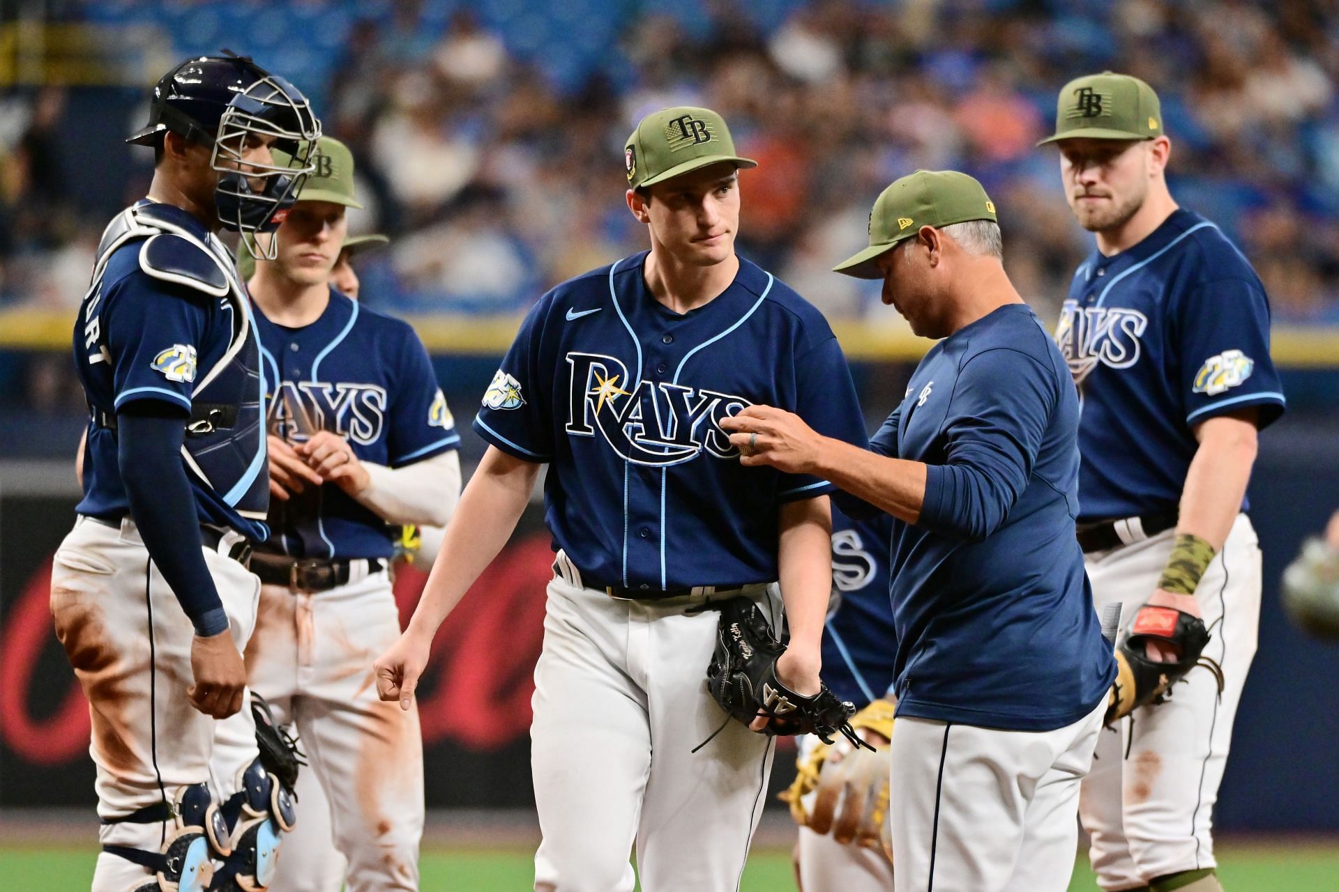 Manager Kevin Cash relieves Kevin Kelly of the Tampa Bay Rays against the Milwaukee Brewers at Tropicana Field