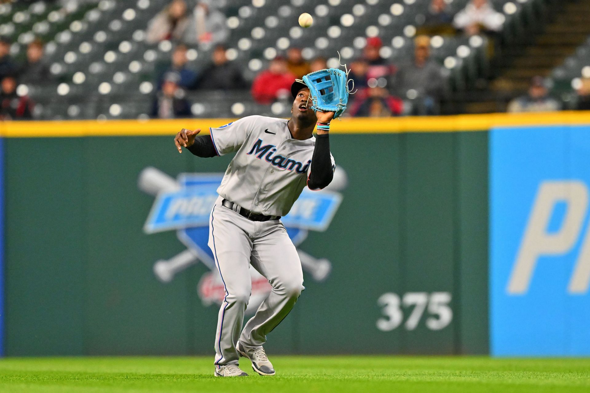 Miami Marlins' Jazz Chisholm loses his helmet as he runs to first base with  a single during the first inning of a baseball game against the New York  Yankees, Sunday, Aug. 1