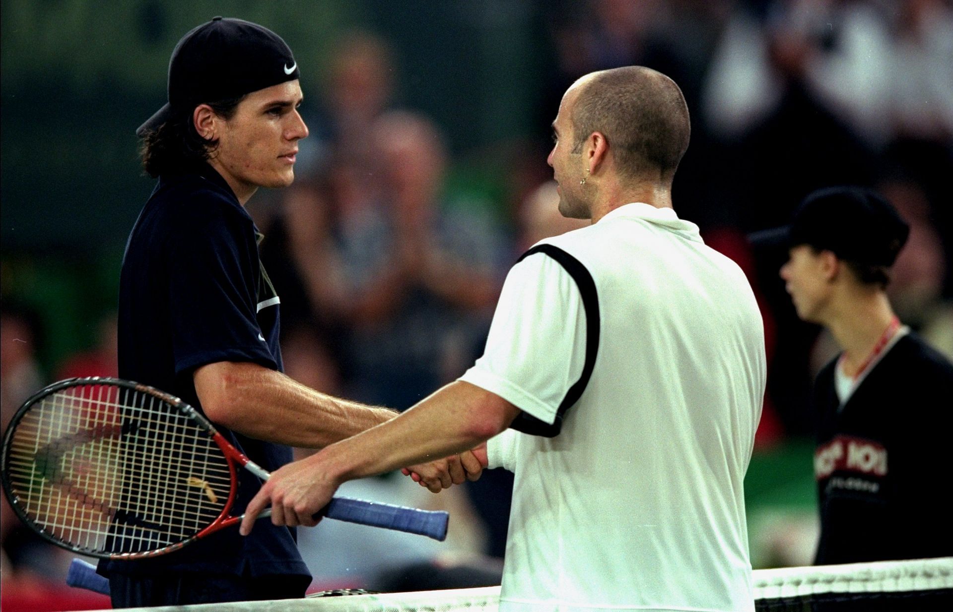 Tommy Haas (L) and Andre Agassi in 1999.