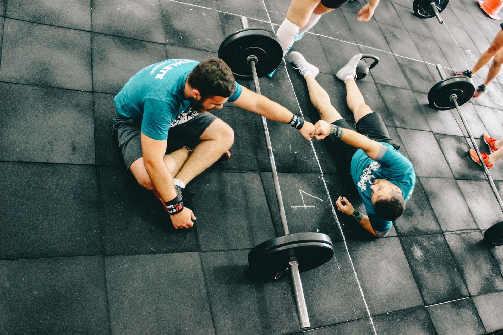 Floor press uses your core muscles. (Image via Unsplash/ Victor Freitas)