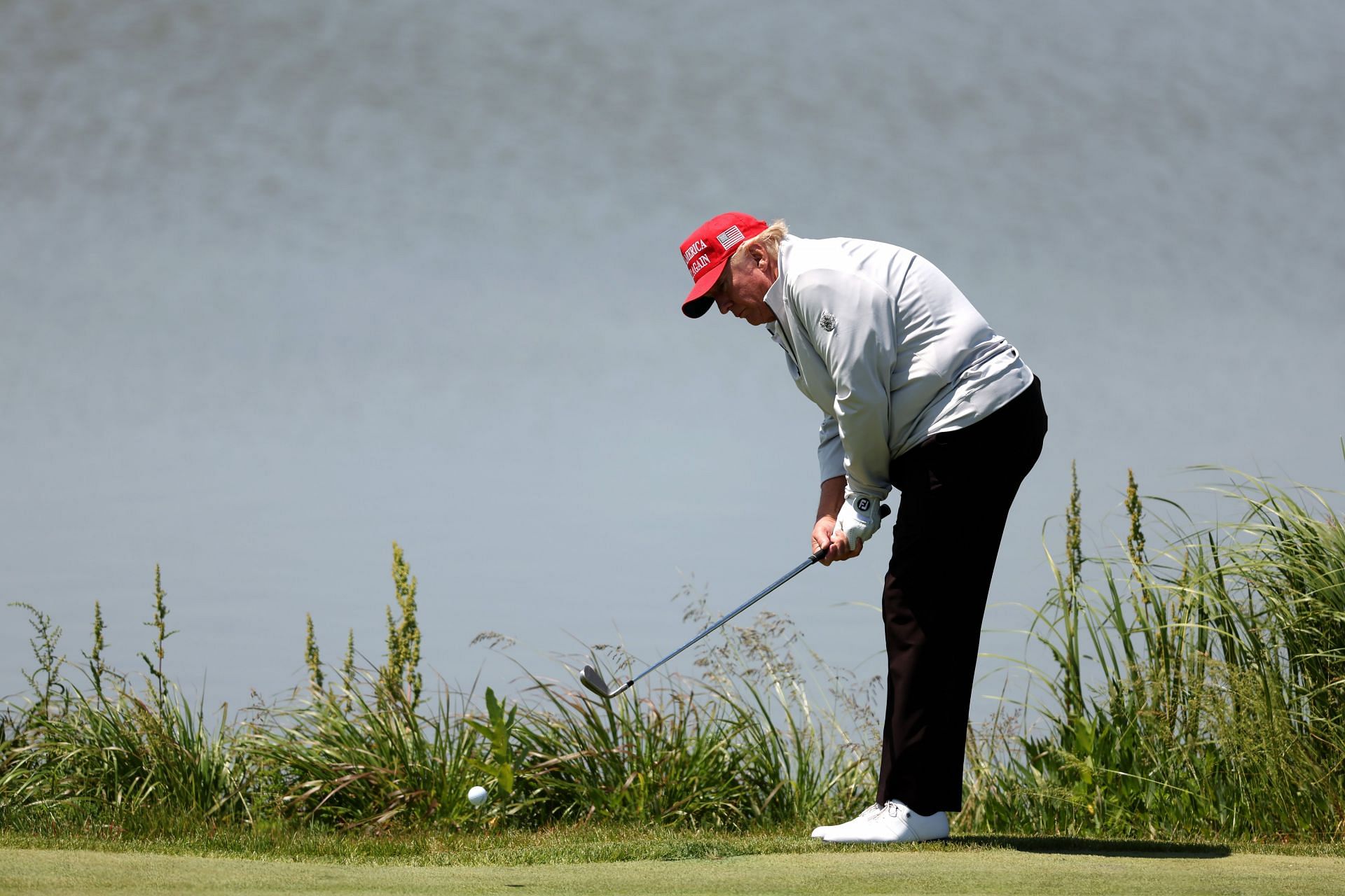 Donald Trump playing shot during the LIV Golf DC - Pro-Am