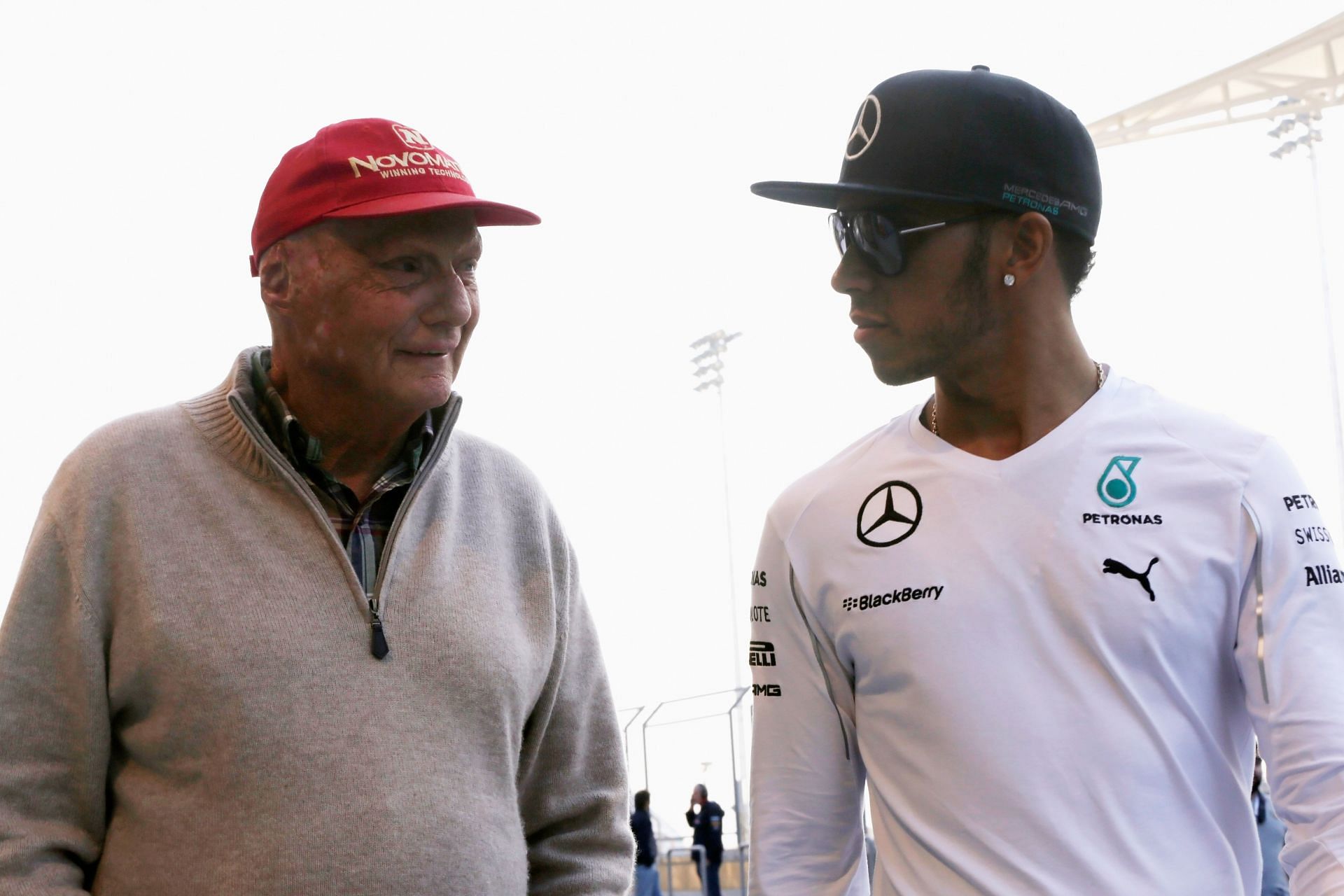 BAHRAIN, BAHRAIN - FEBRUARY 20: Niki Lauda the non-executive chairman of the Mercedes AMG Petronas F1 Team is seen with Lewis Hamilton of Great Britain and Mercedes GP during day two of Formula One Winter Testing at the Bahrain International Circuit on February 20, 2014 in Bahrain, Bahrain. (Photo by Andrew Hone/Getty Images)
